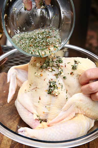 Image of Place the chicken into a larger capacity bowl. Pour and...