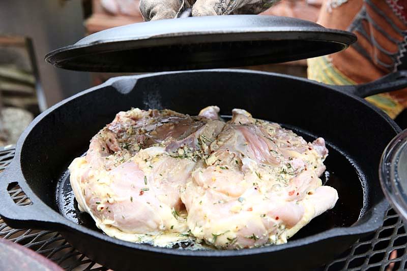 Image of In order to make sure the chicken adheres to the skillet completely,...