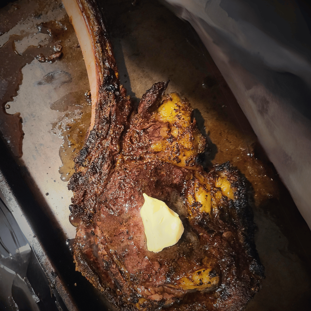 Image of Remove the steak from the grill. Place 1 tbsp butter...