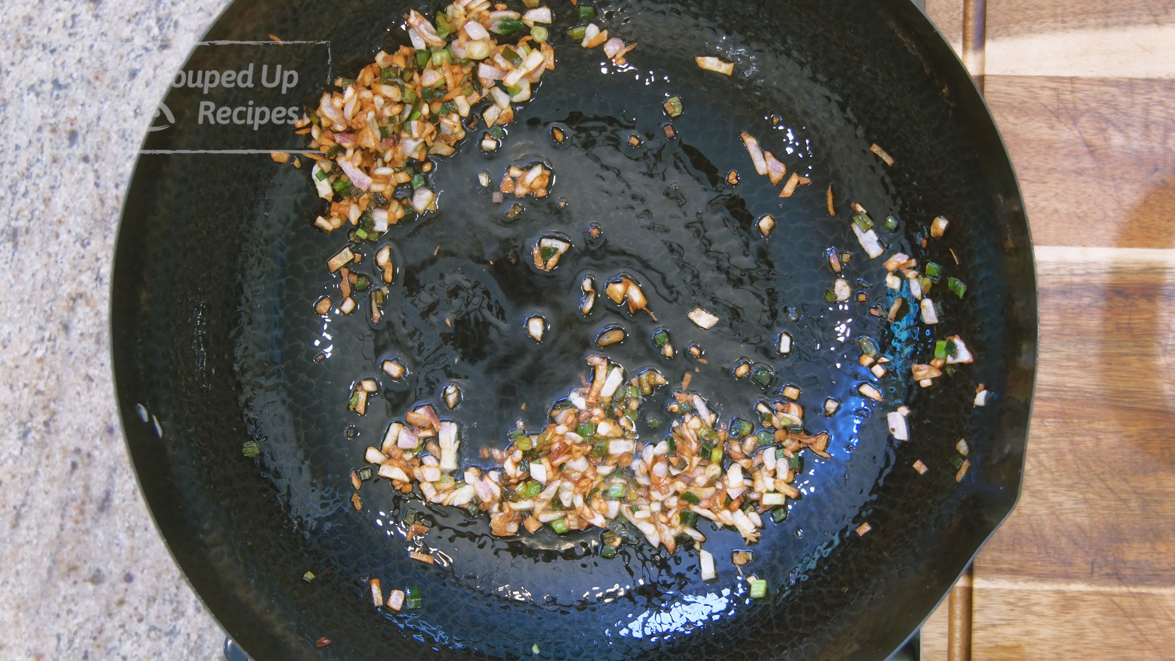 Image of Turn the heat to medium and preheat the wok until...