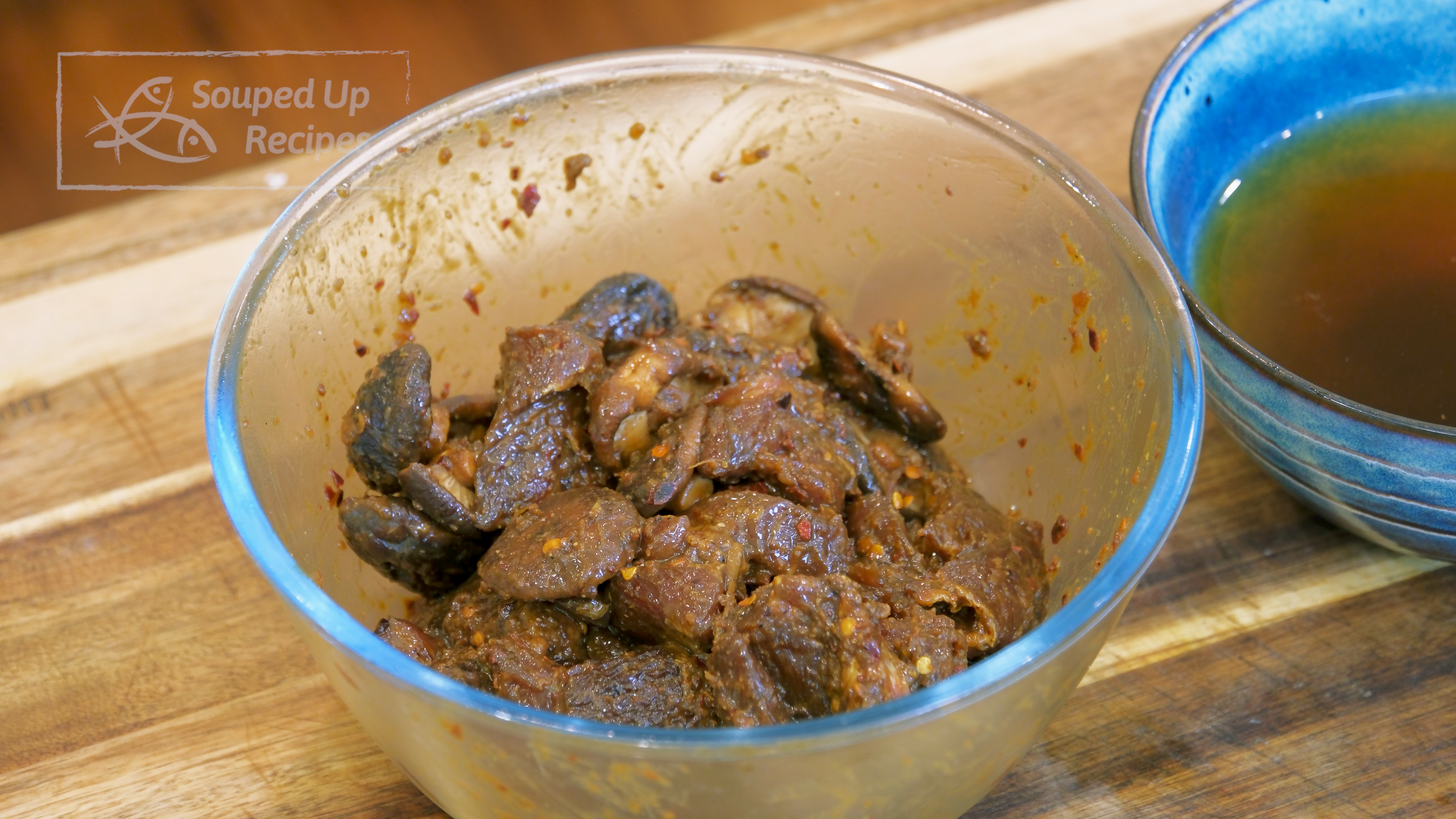 Image of Add the mushrooms to the beef and stir so they...