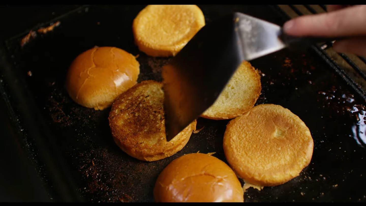 Image of Toast the cut side of the buns on the griddle...