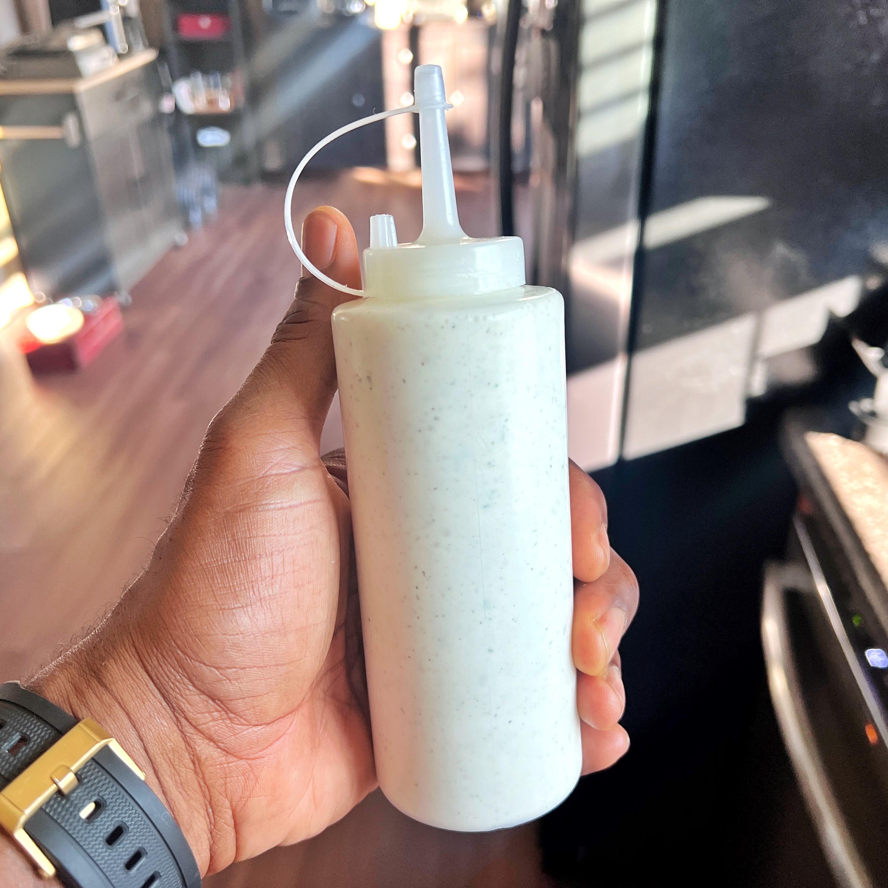 Image of Optional: Fill a plastic condiment bottle with the white sauce....