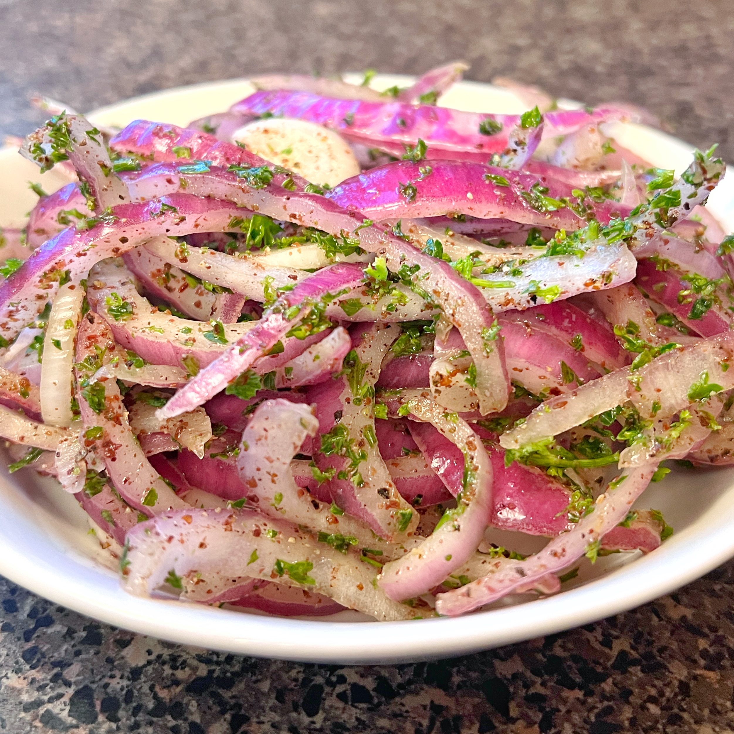 Image of Place the onion slices in a bowl, season with salt...