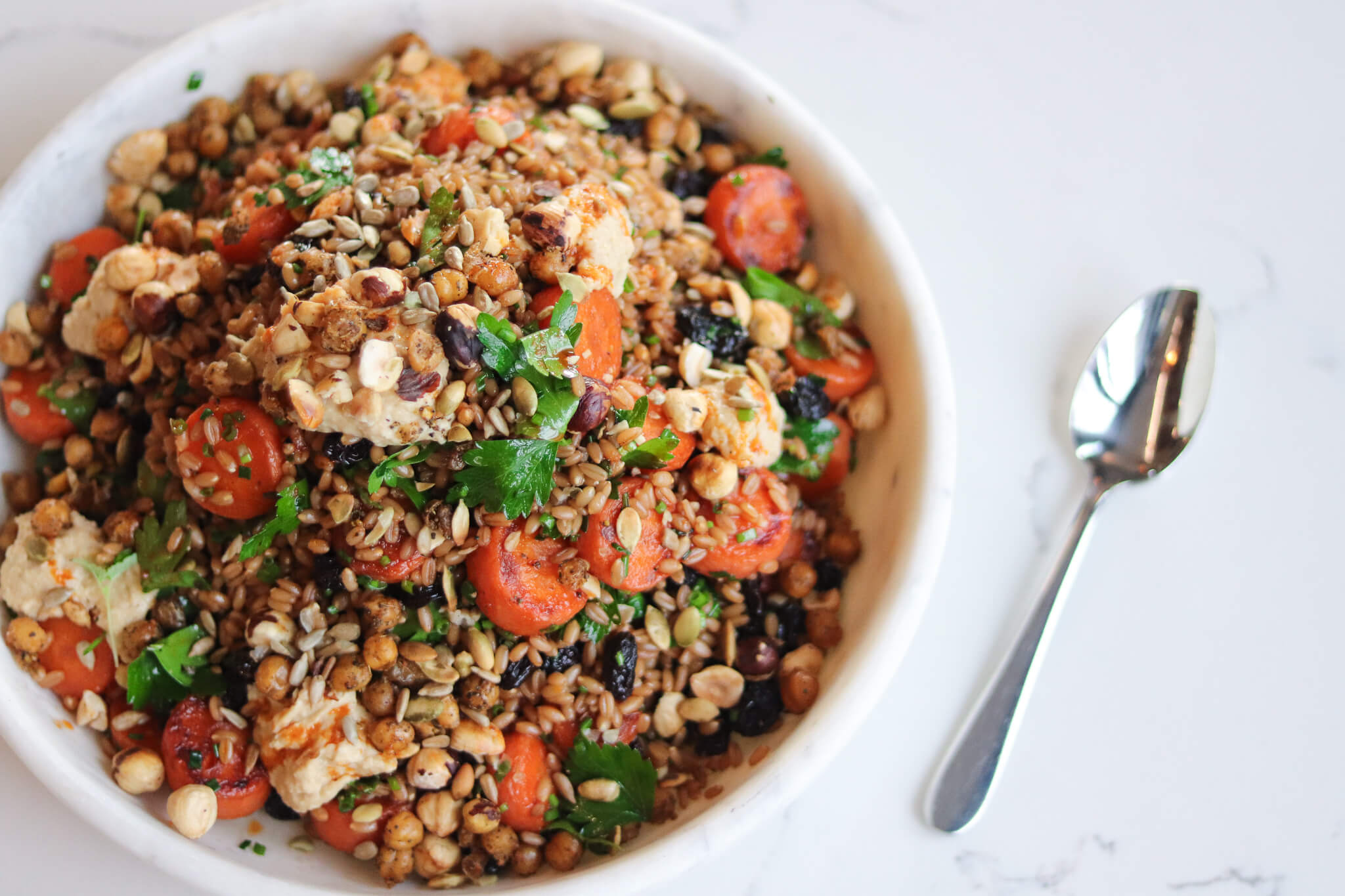 farro & roasted carrot salad with raisins, harissa & chickpeas