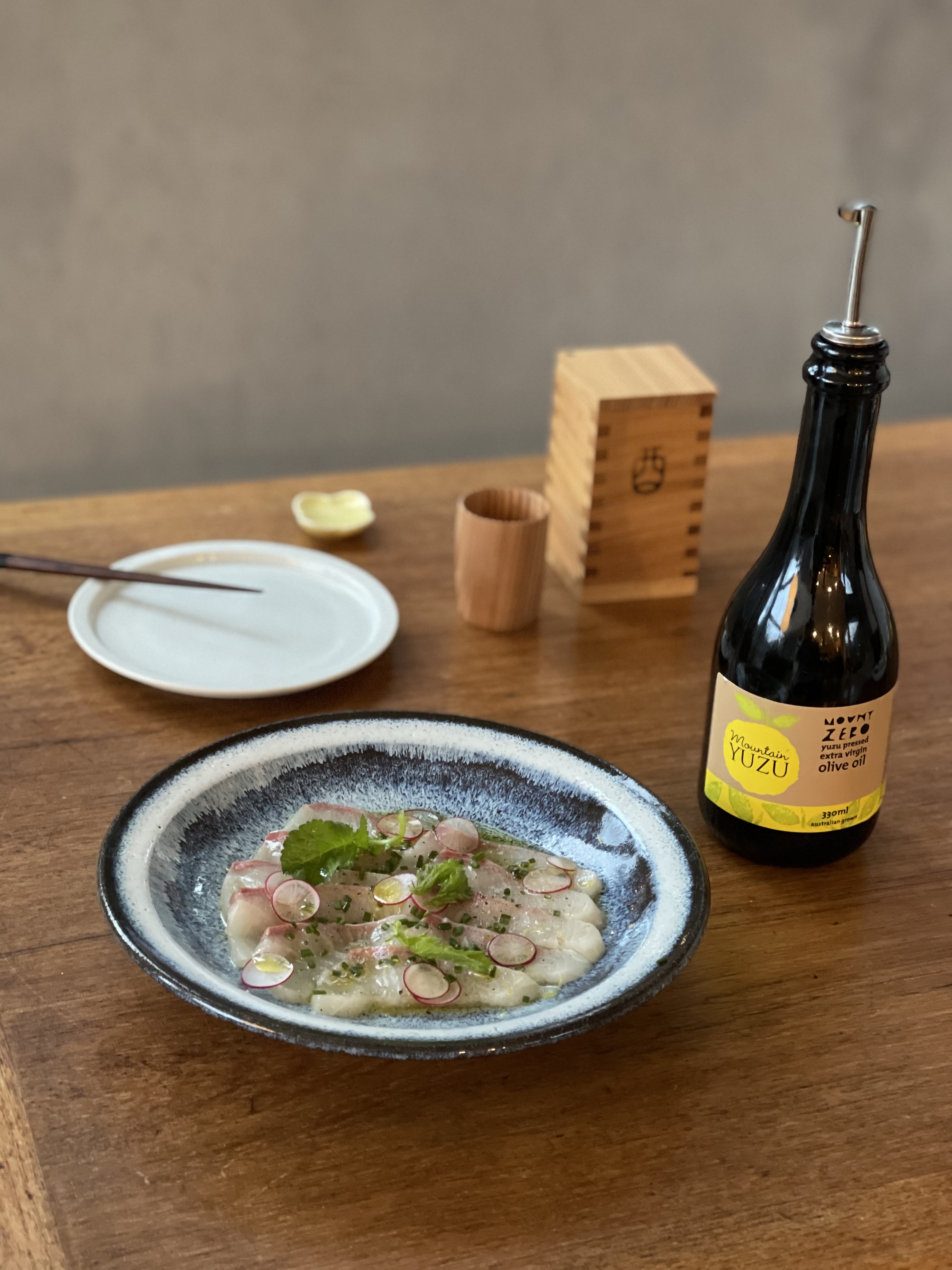 kingfish crudo with yuzu pressed extra virgin olive oil