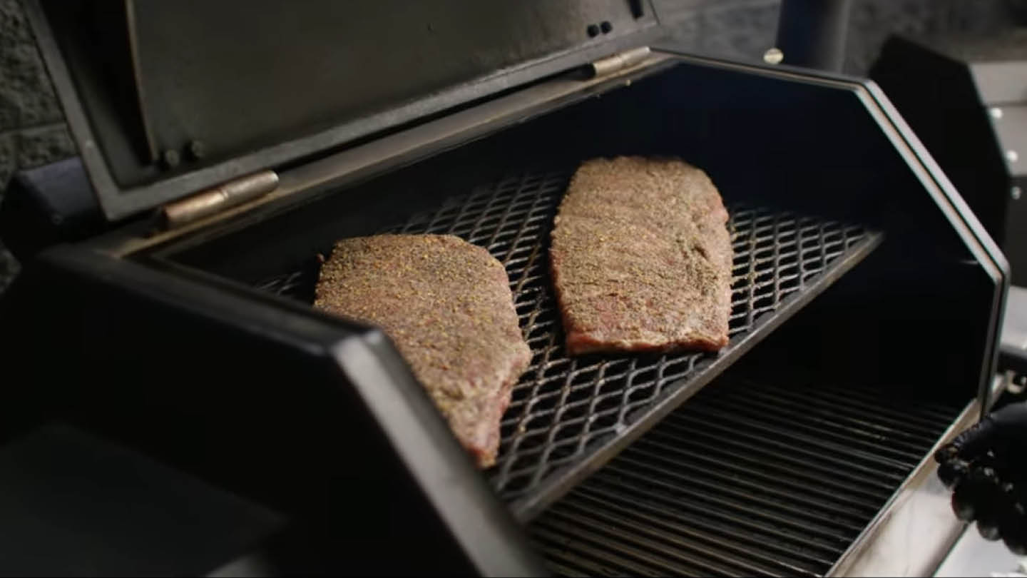 Image of Place the ribs on the second shelf of the grill...