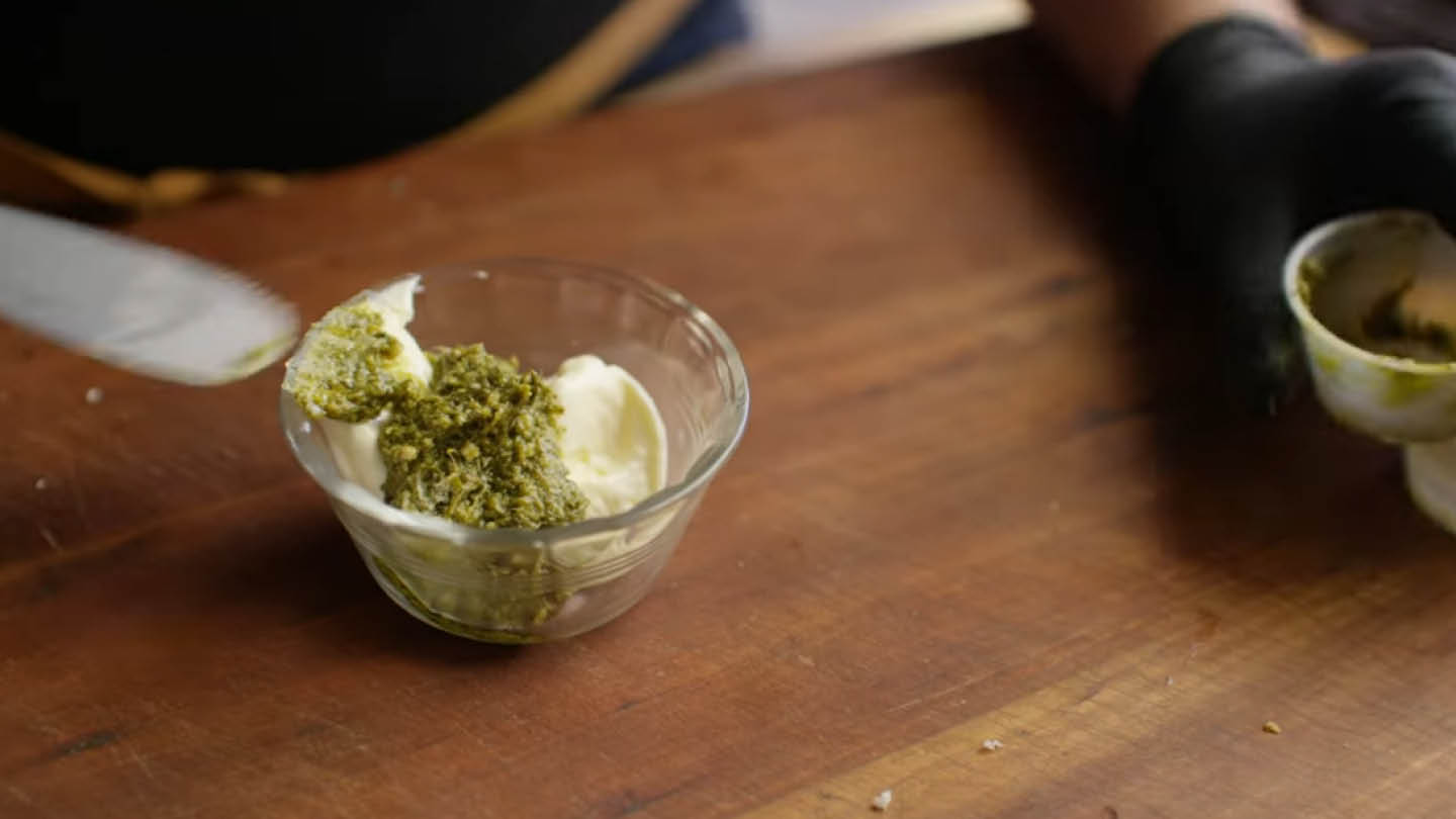 Image of Combine the mayonnaise and pesto and whisk to combine.