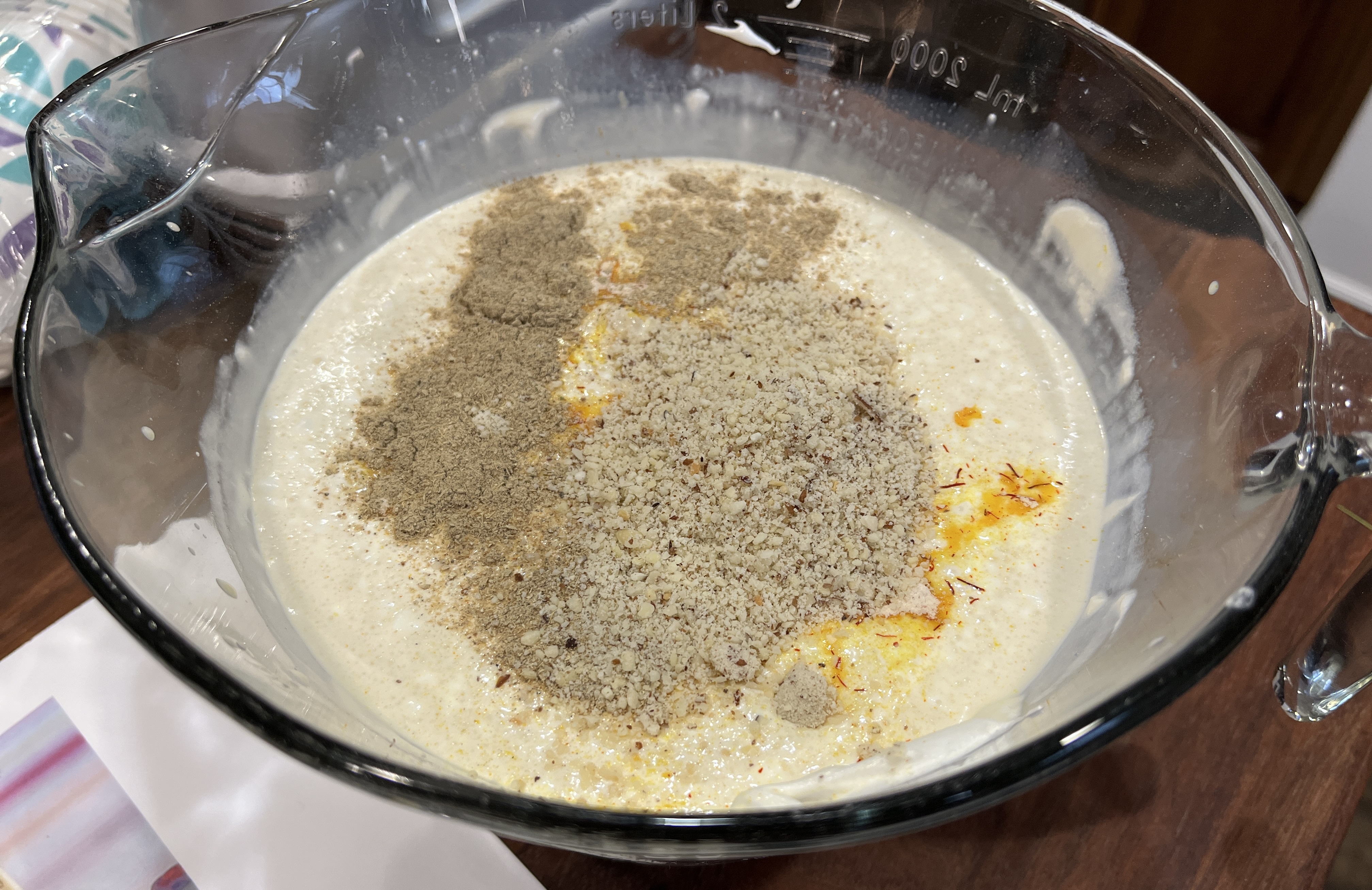 Image of Add ground almond, cardamom powder and saffron/sugar mixture and stir...