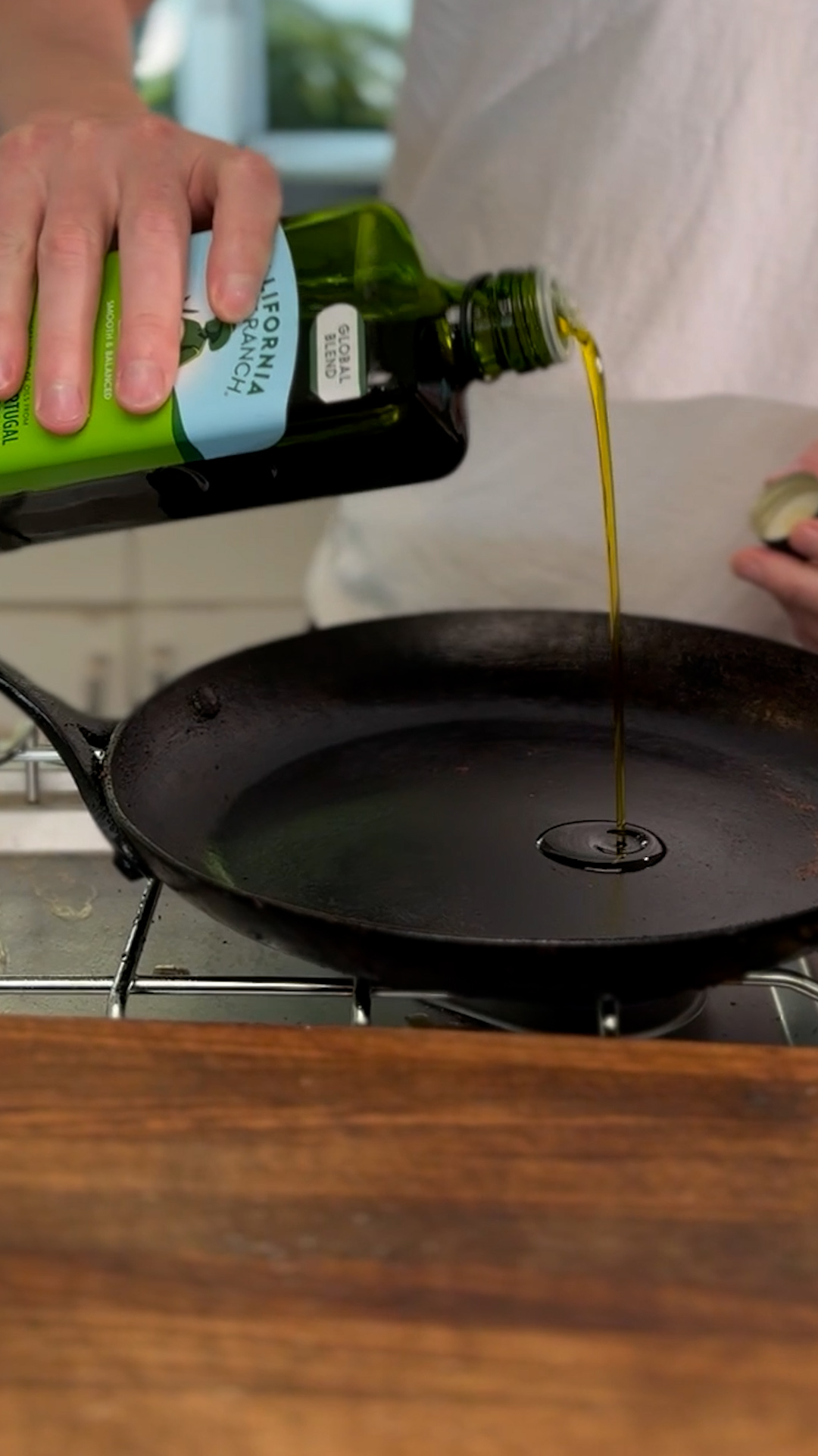 Image of Pour olive oil into a heated pan