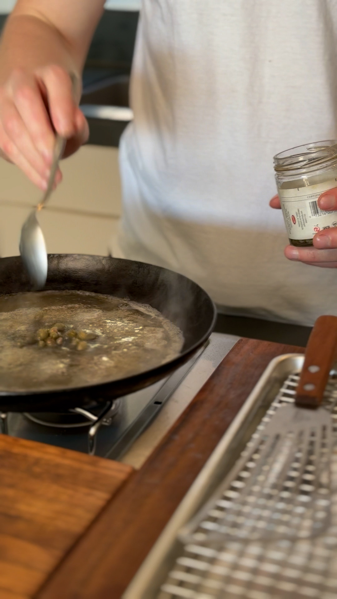 Image of For the sauce, pour white wine, bone broth & capers...