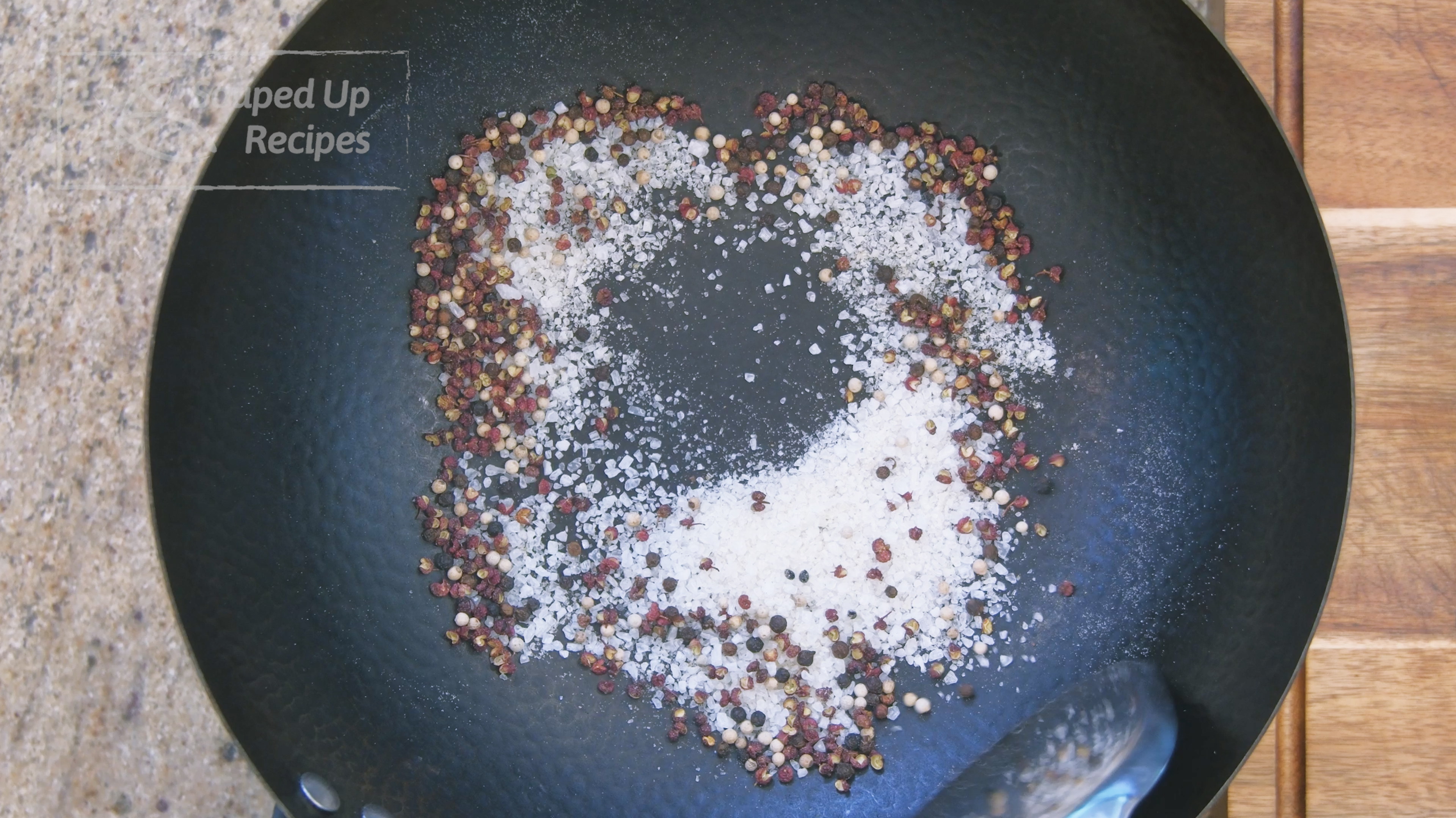 Image of Add the Sichuan peppercorns, salt, white, and black pepper in...