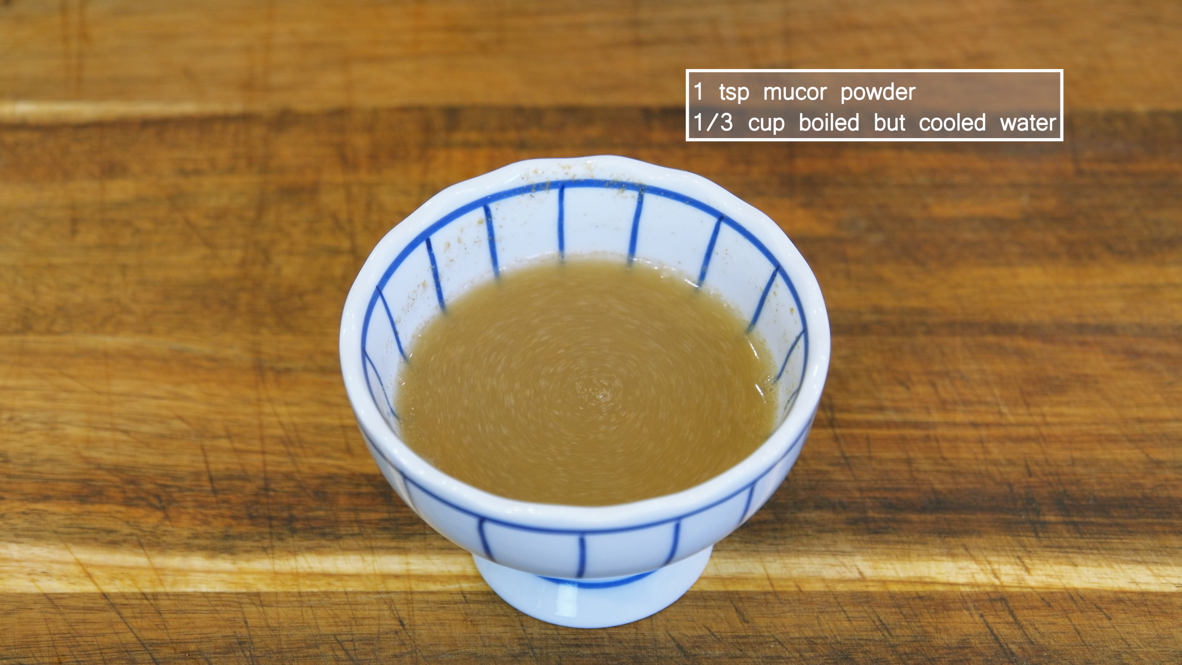 Image of Combine 1 tsp mucor powder with 1/3 cup of boiled...