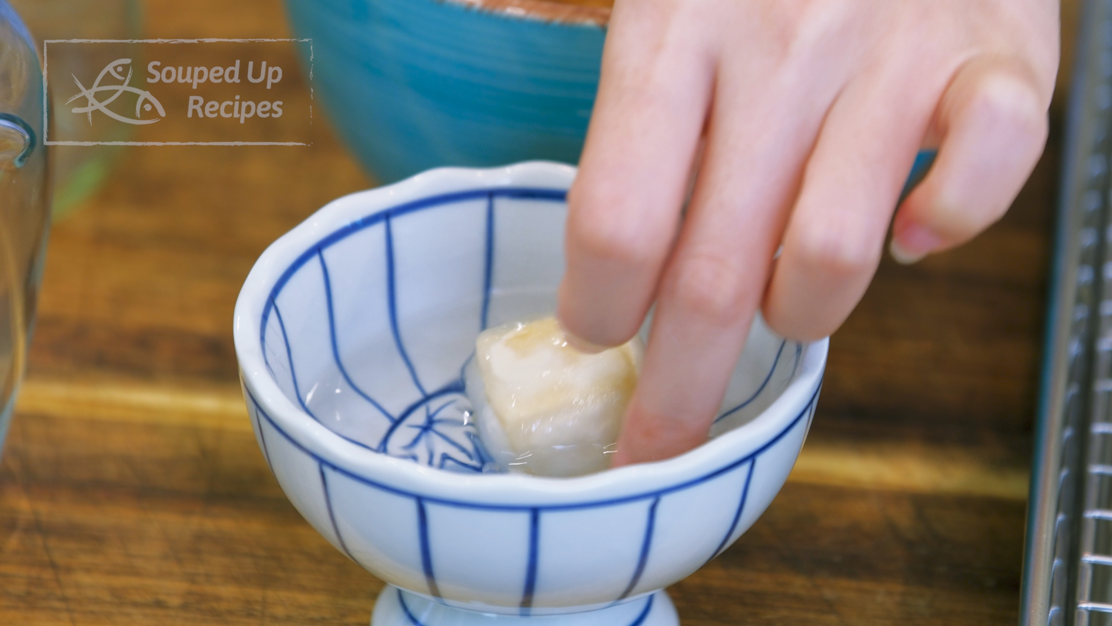 Image of Take a piece of tofu and dip it in the...