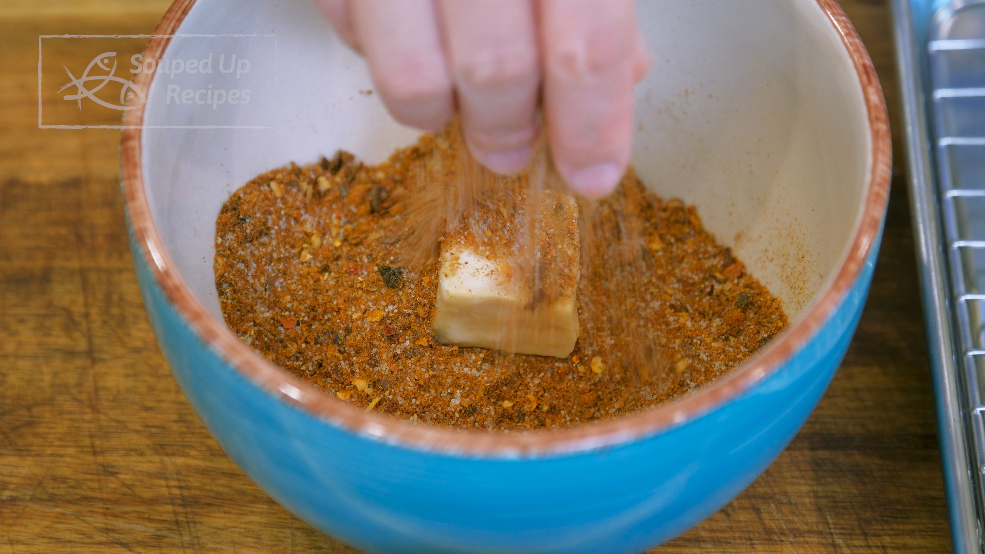 Image of Gently put the tofu into the spice mix and coat...