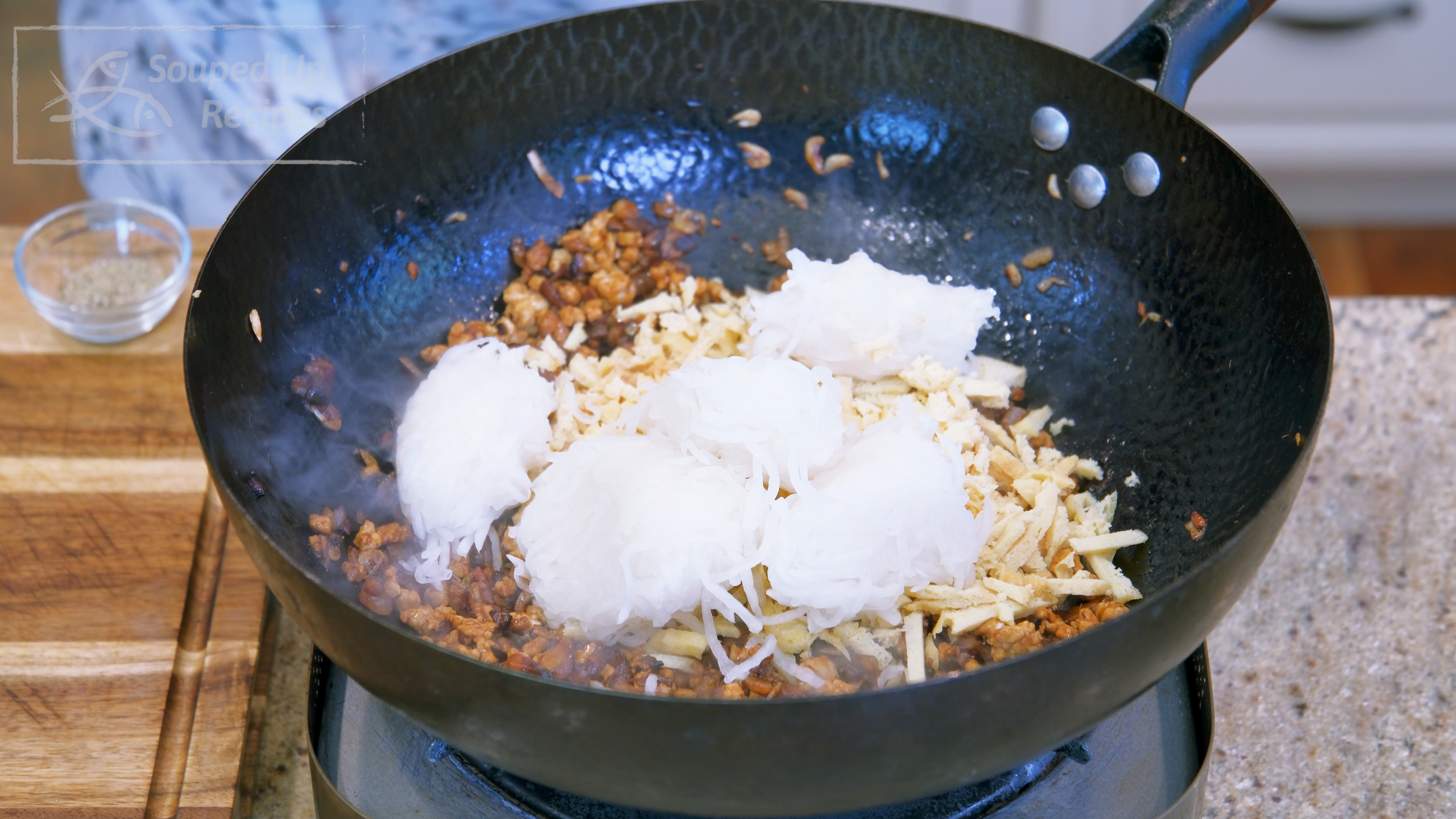 Image of Add the julienned tofu puff and the shredded radish. Stir well...