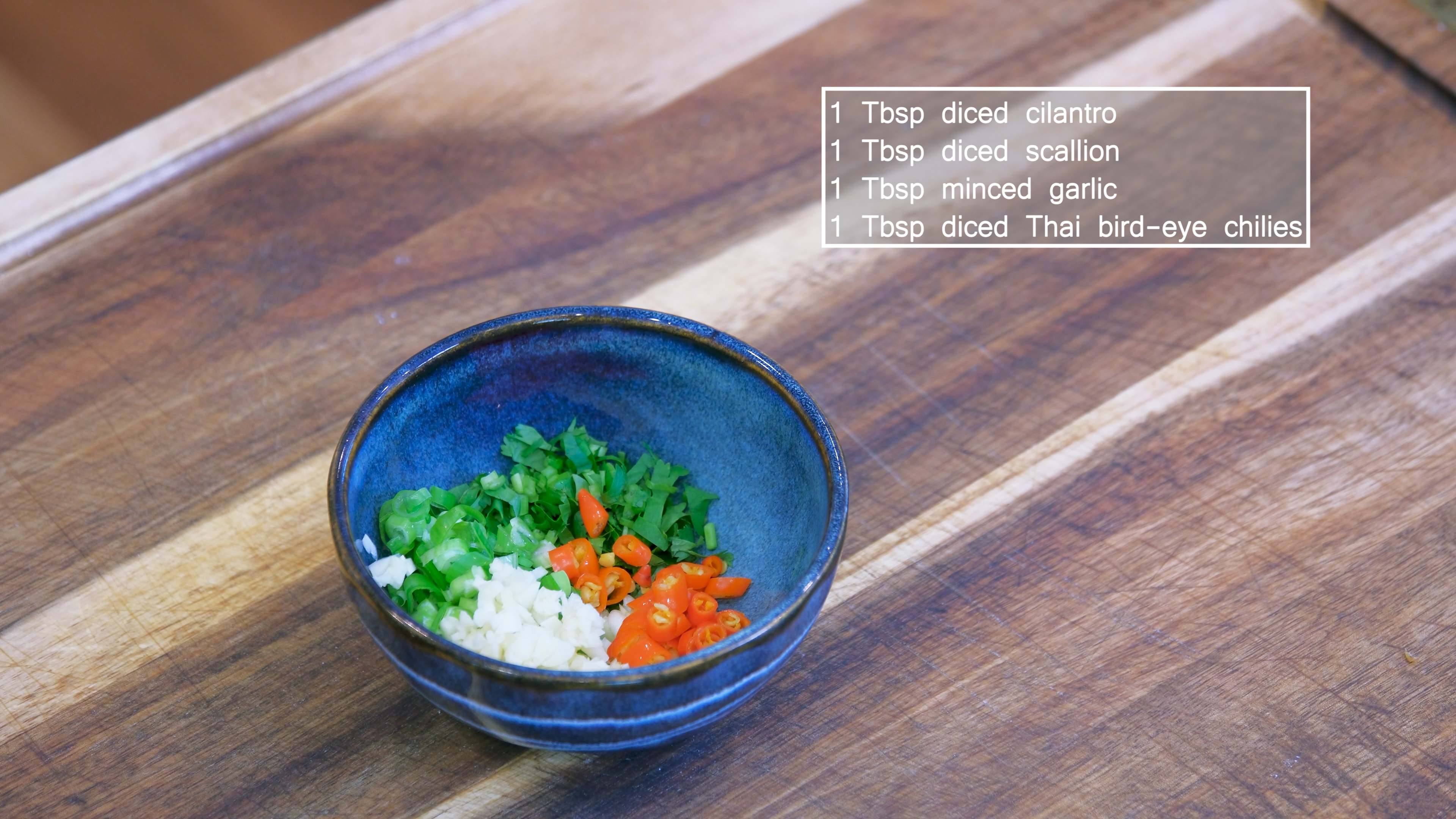 Image of In a heat-proof bowl, add diced cilantro, scallion, garlic, and...