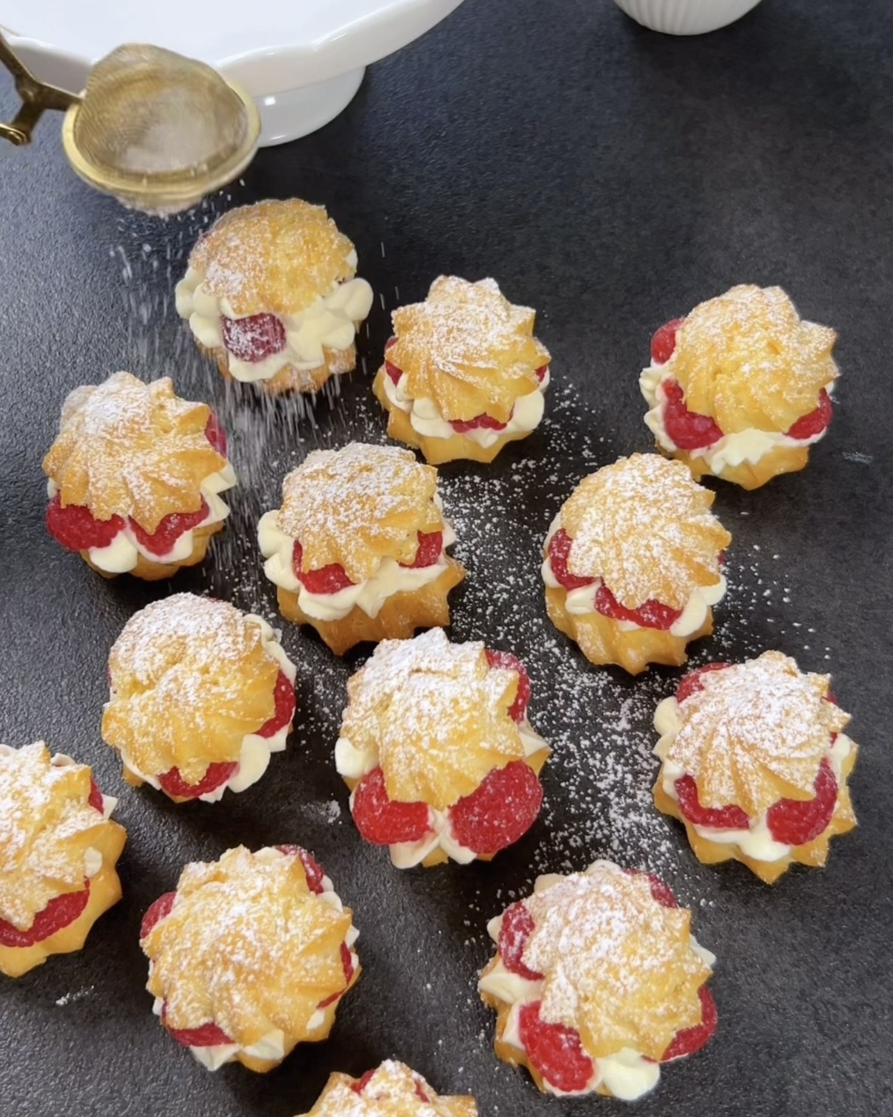 Image of Dust the cream puffs with powdered sugar if desired.