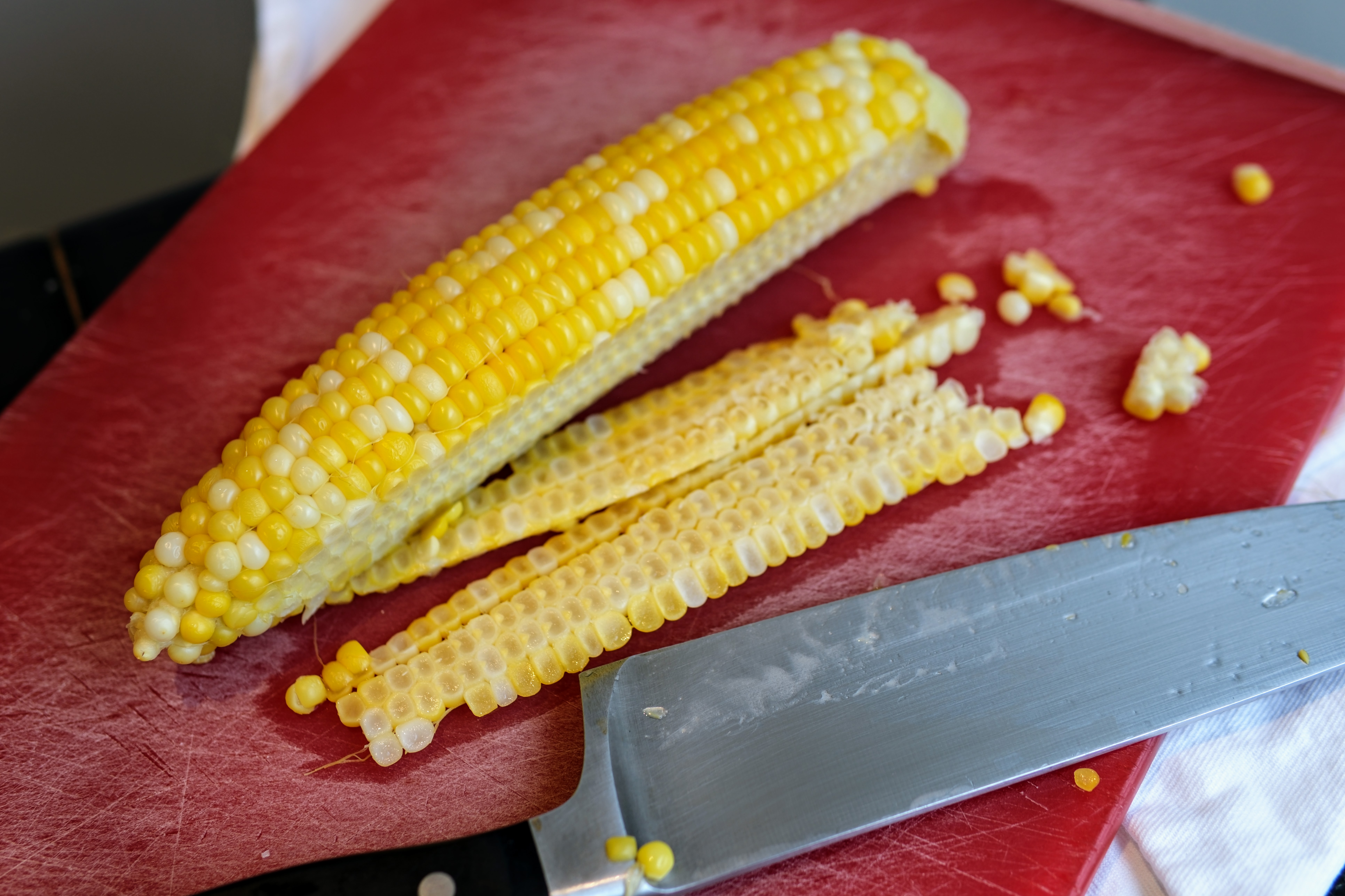 Image of Carefully slice the kernels from the corn cob. Doing so...