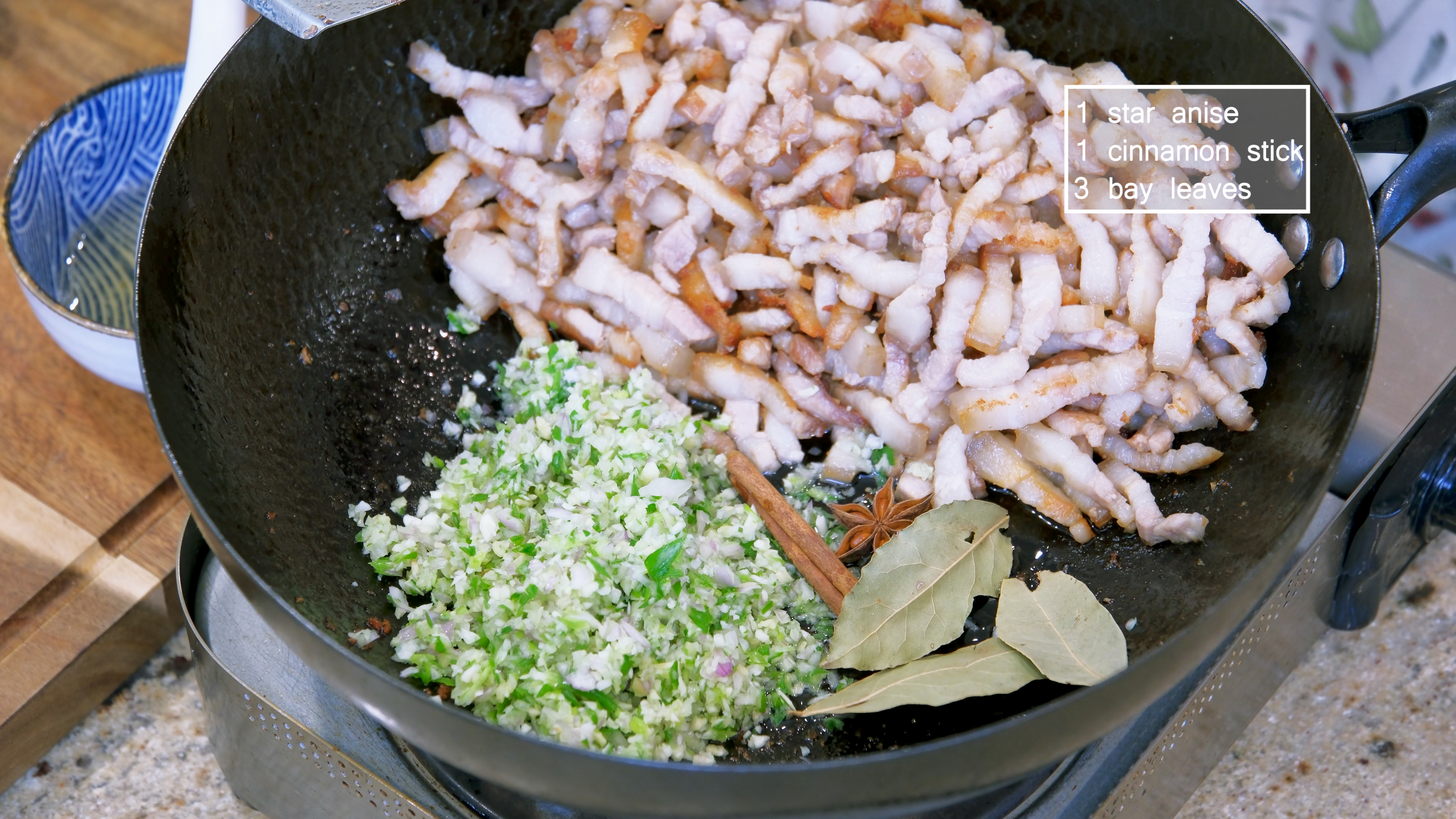 Image of Add the chopped aromatics to the wok along with 1...