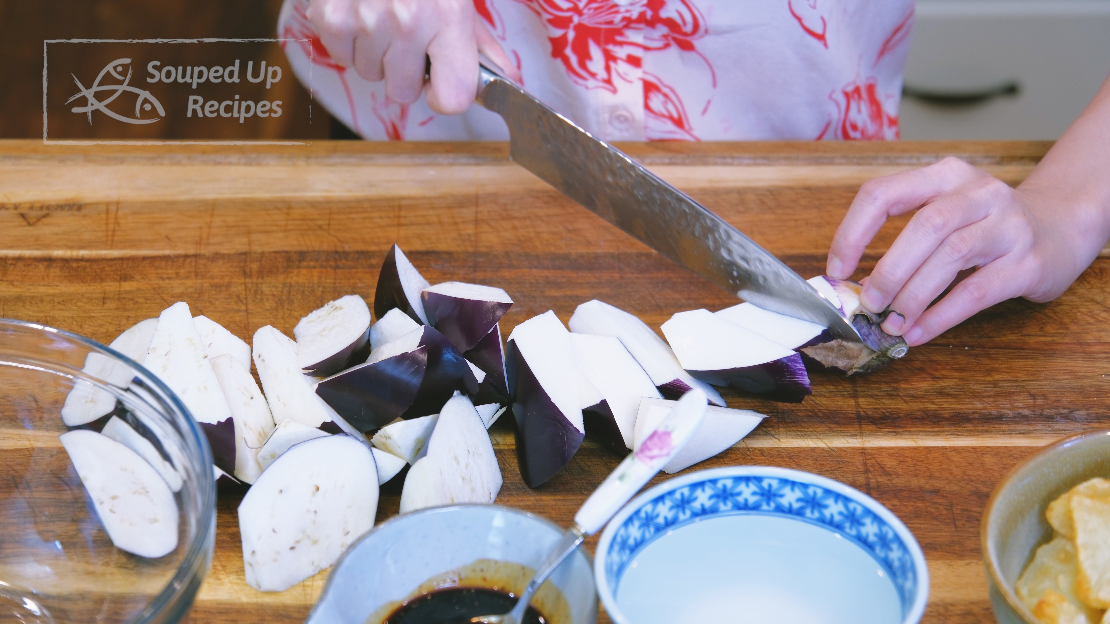 Image of Use the roll-cutting technique to cut the eggplants into a...