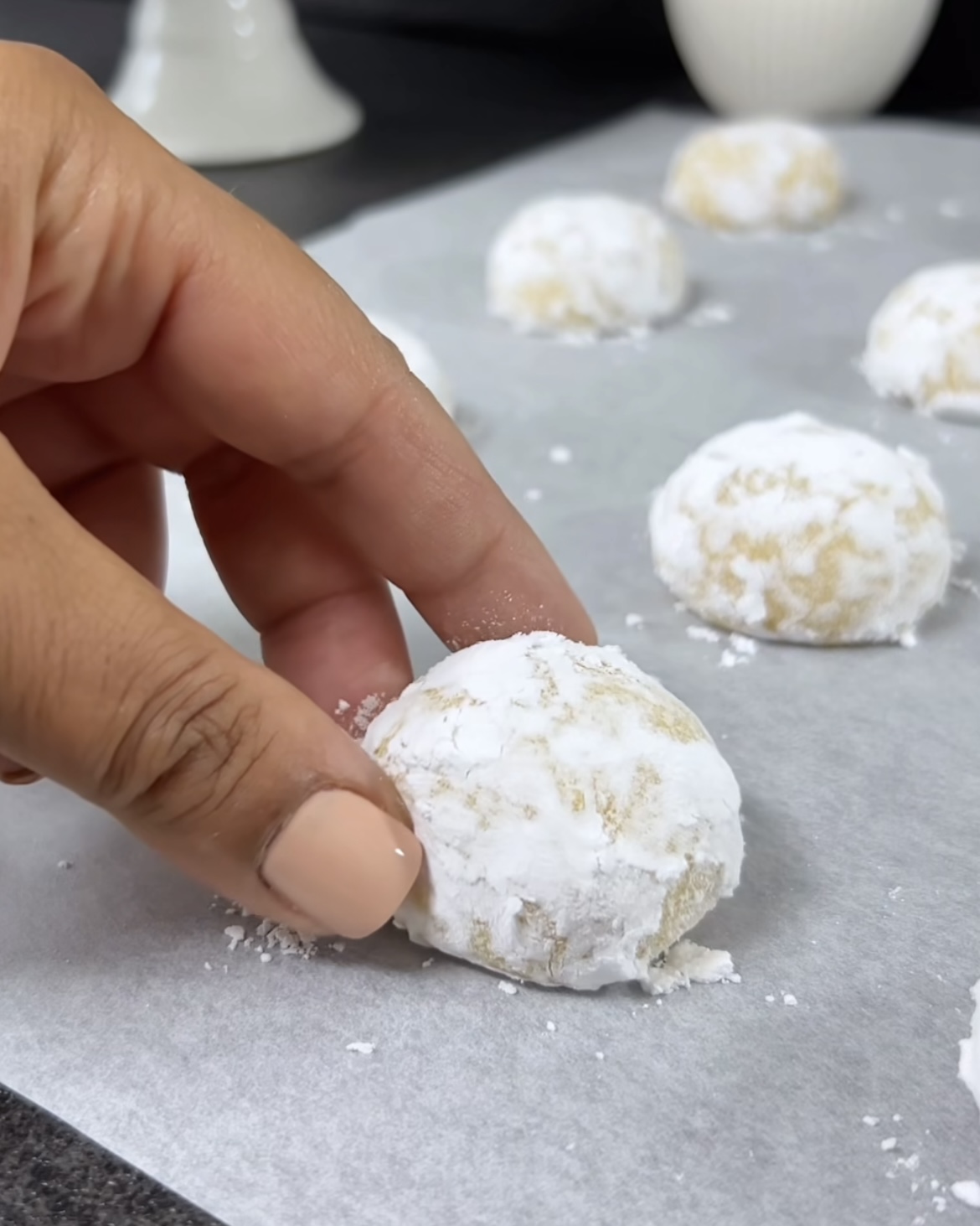 Image of Place the dough balls on the prepared baking sheet, spacing...