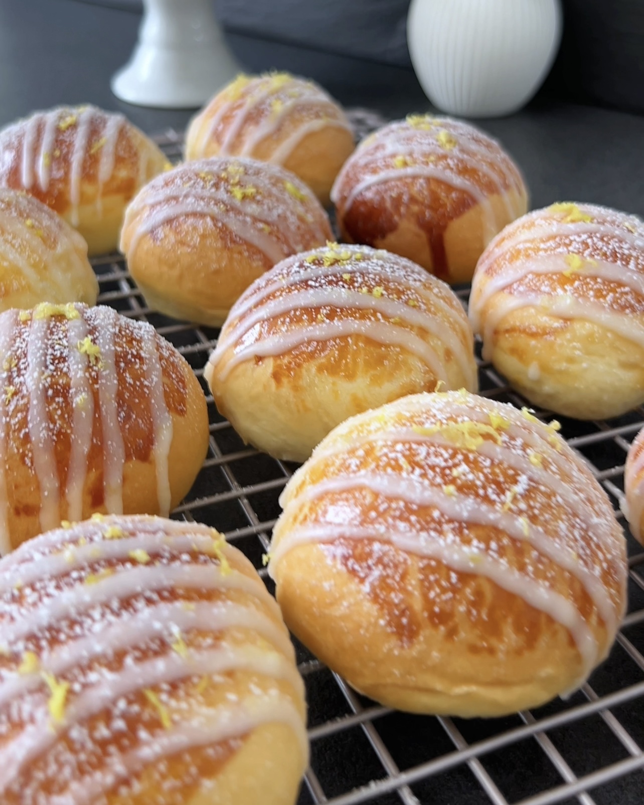 Image of Drizzle the glaze in thin lines over the cooled brioches.