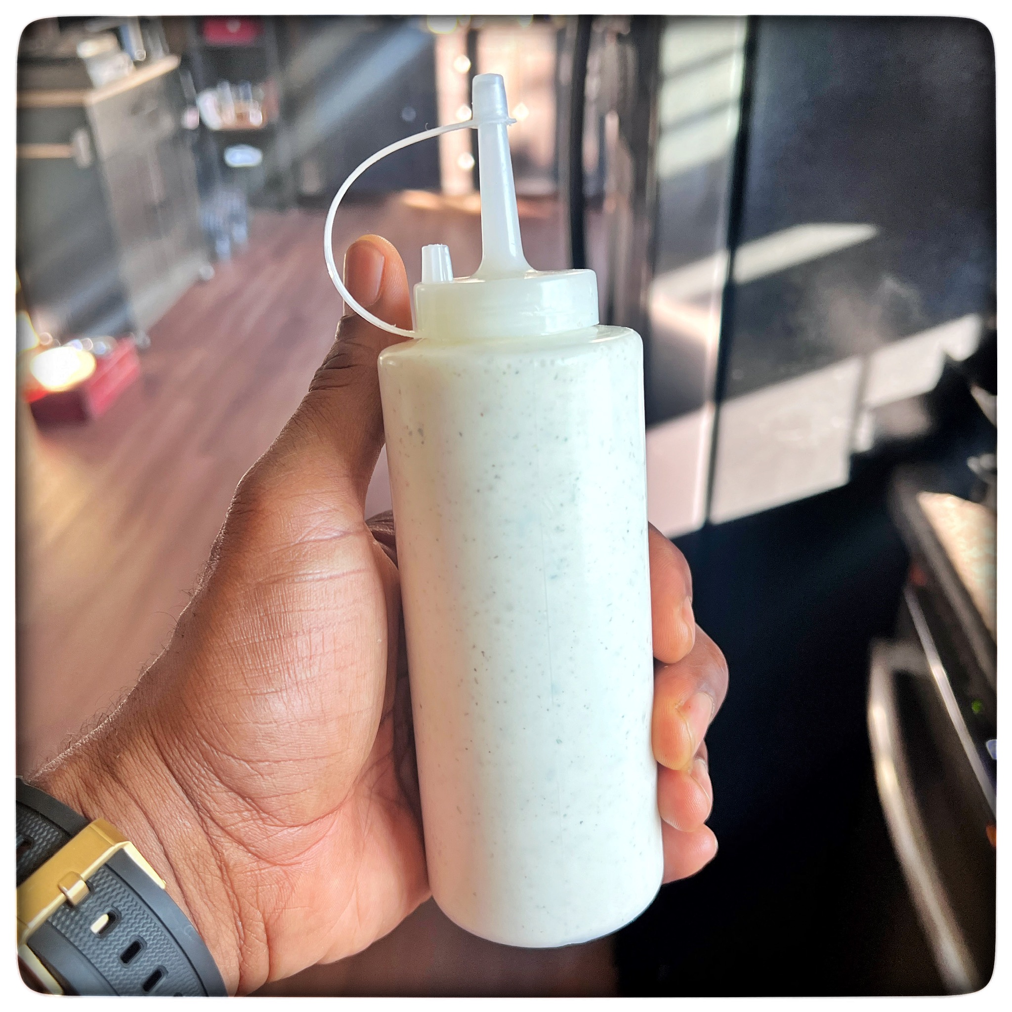 Image of Optional: Fill a plastic condiment bottle with the white sauce....