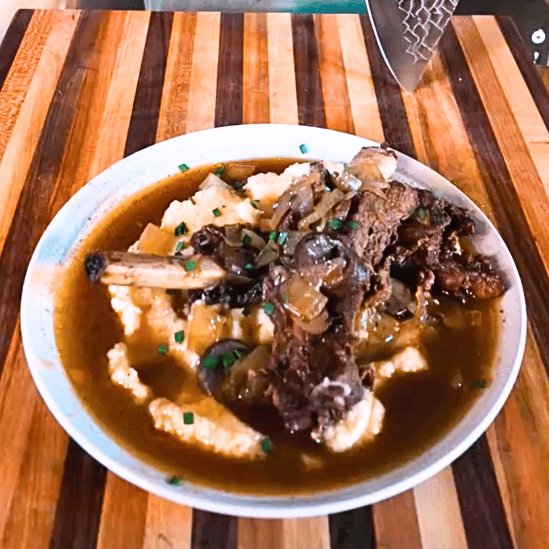 Image of Spoon the tender, braised ribs over a bed of creamy...