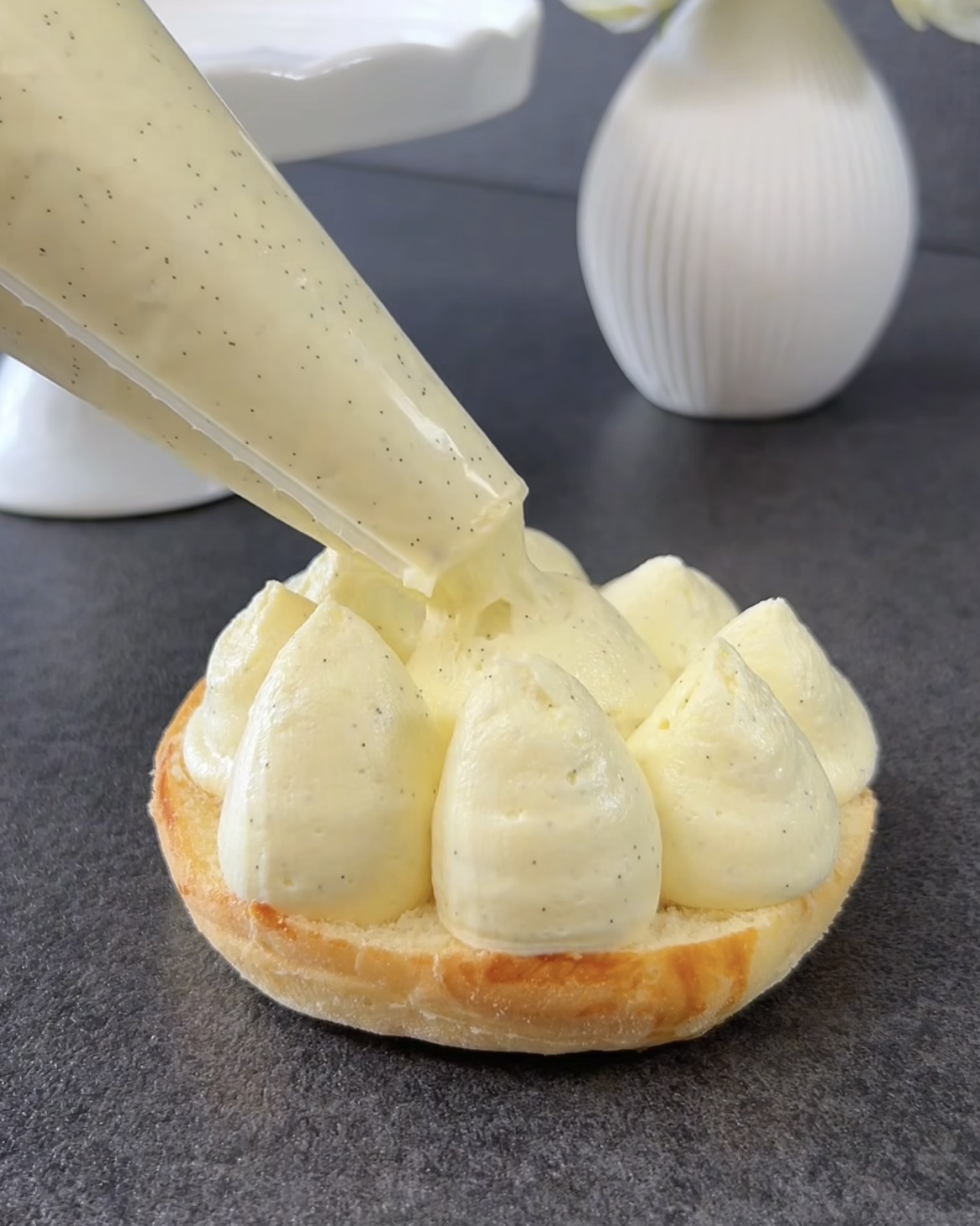 Image of Cut the cooled pastries in half horizontally. Pipe the crème...