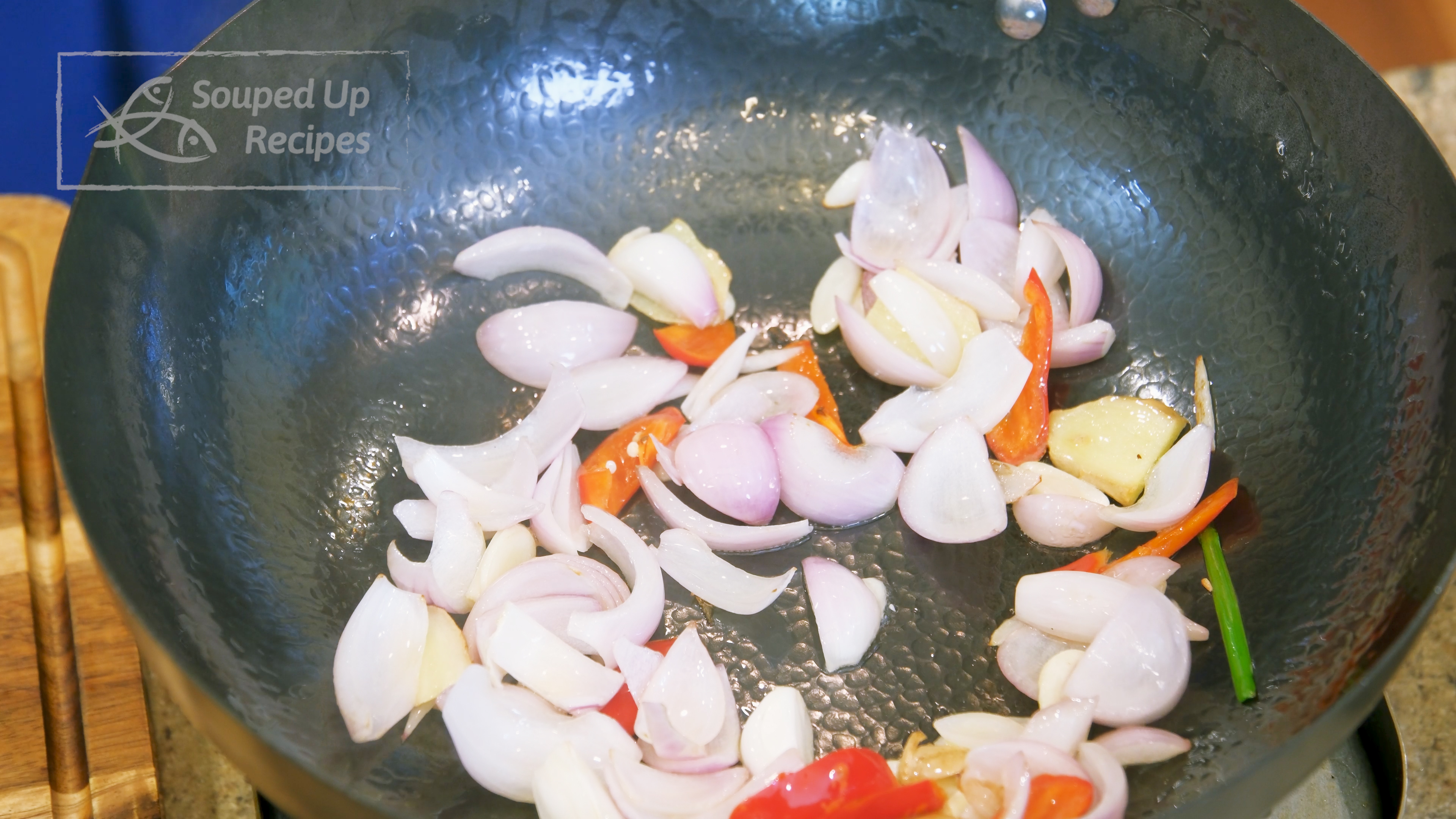 Image of Turn the heat to high and heat the wok until...