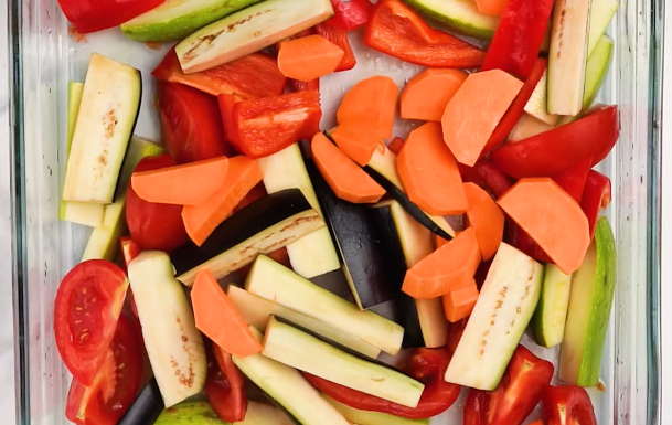 Image of In a baking dish, combine zucchini, sweet potatoes, potatoes, tomatoes,...