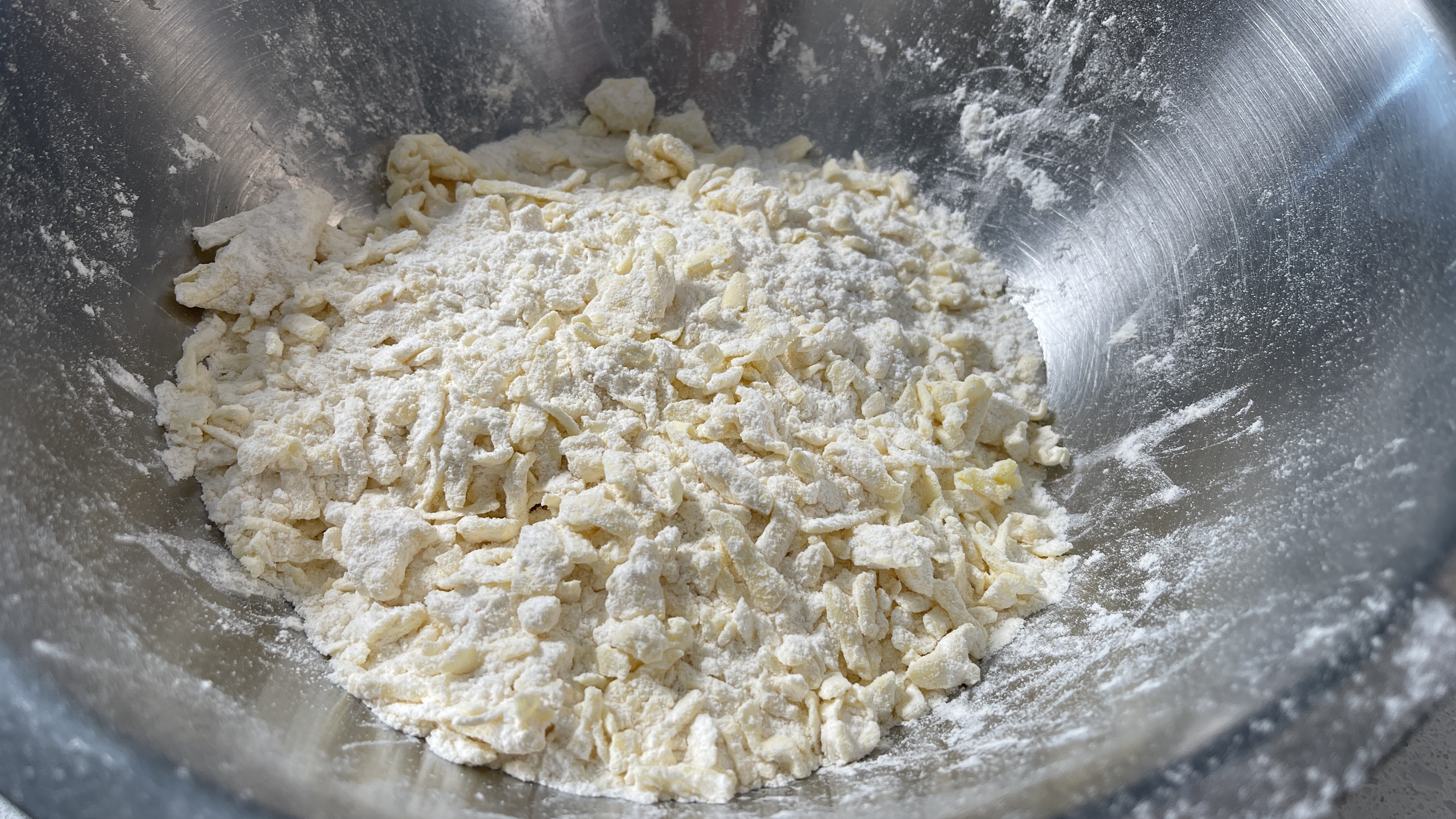 Image of grate the par frozen butter into the flour mix, gently...