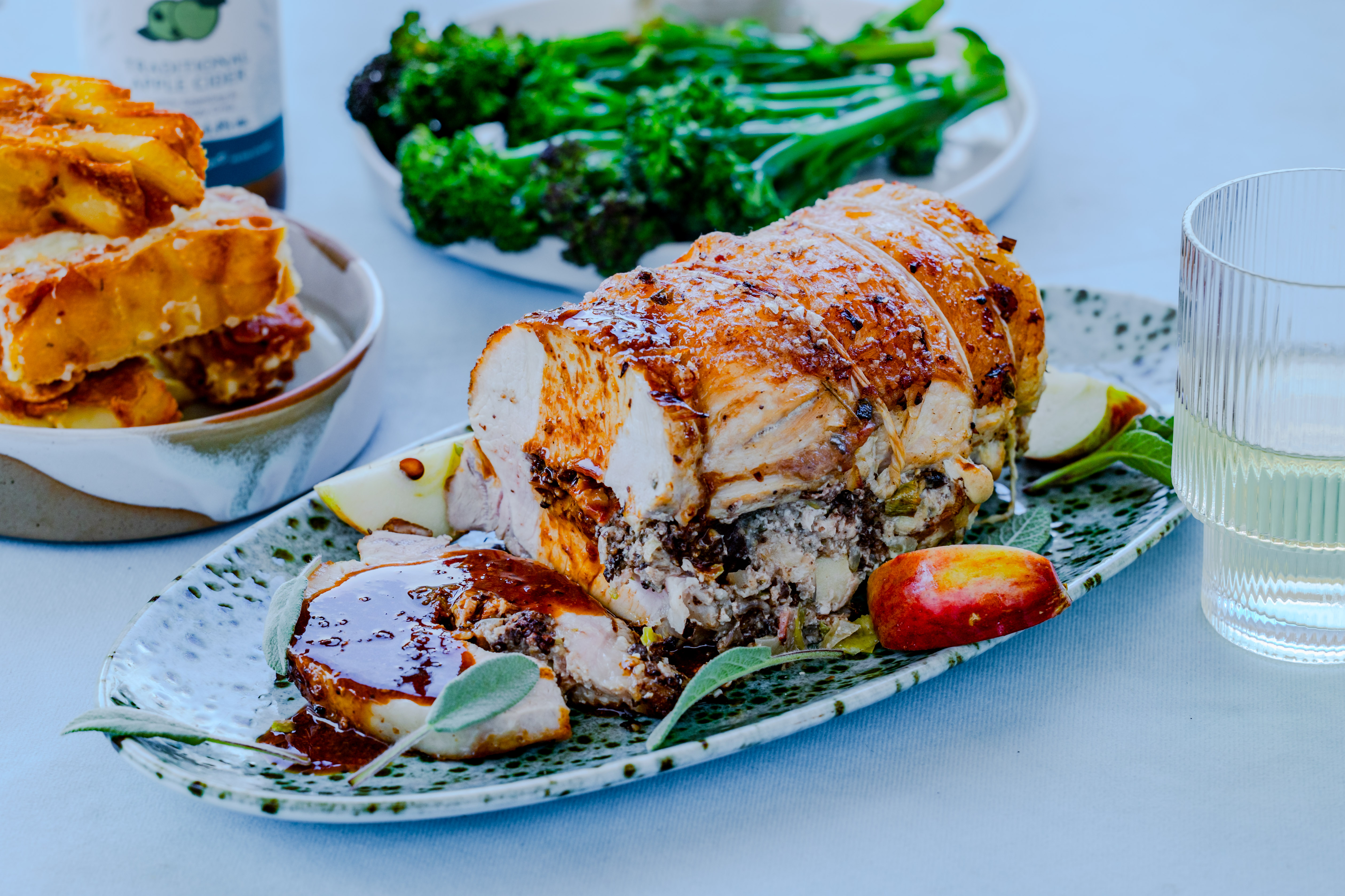 Black Pudding and Bacon Stuffed Pork Loin with Cider Sauce and Confit Potatoes