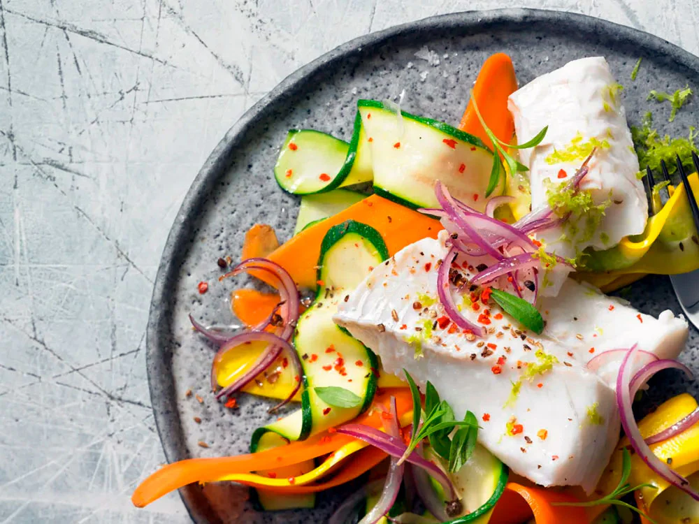 Steamed cod with vegetable ribbons