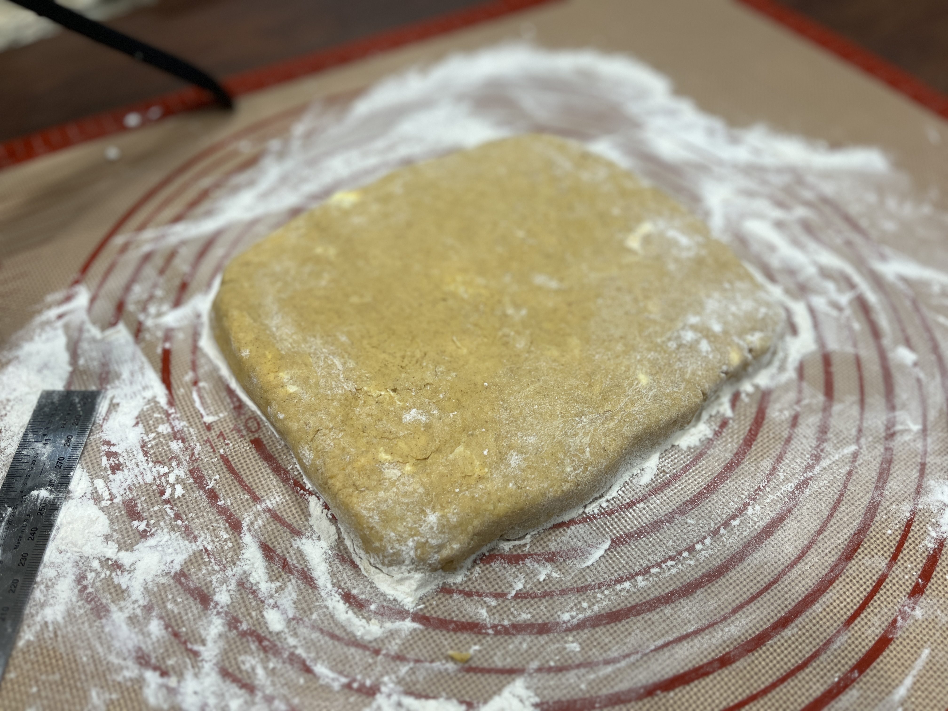 Image of Turn the dough out onto a floured surface and with...