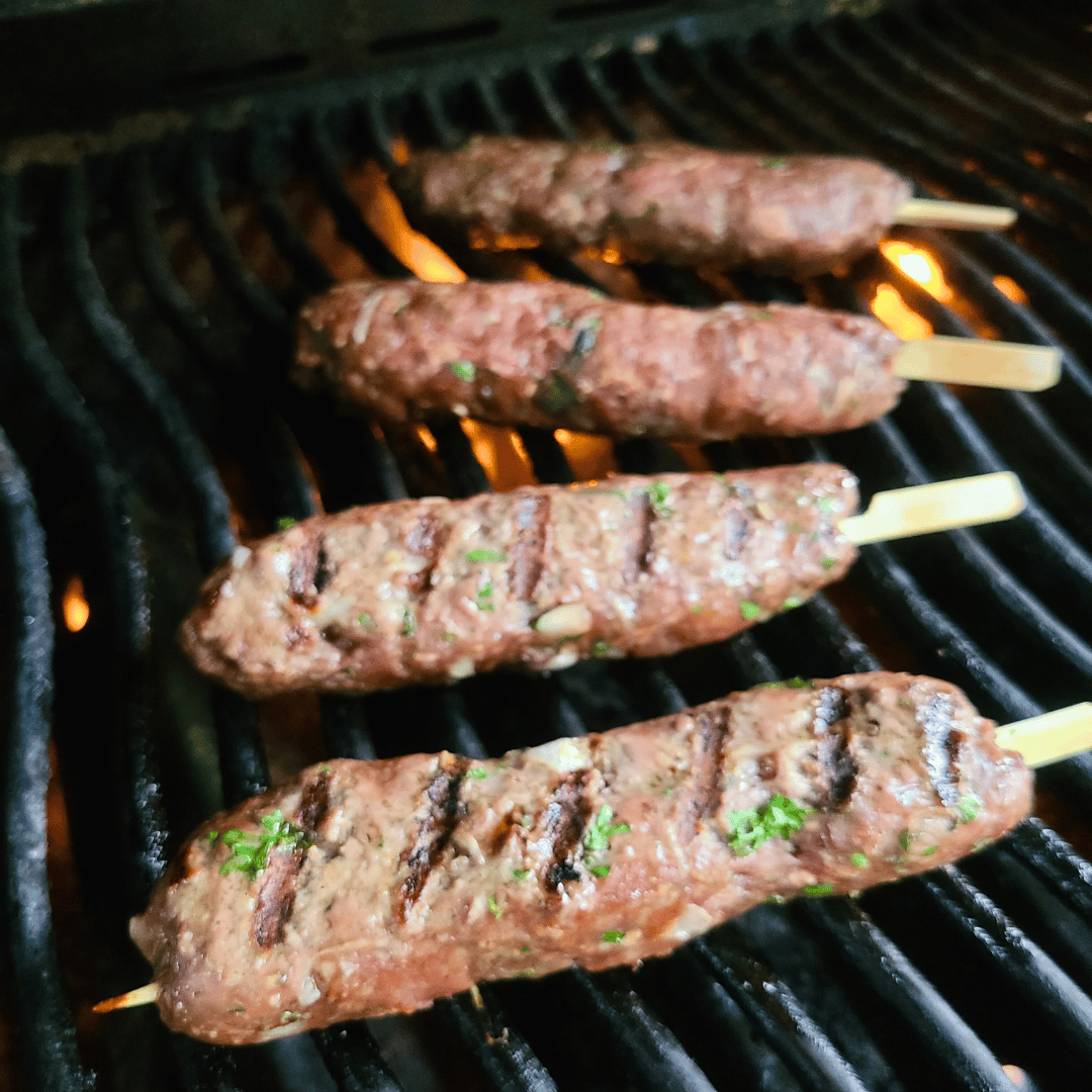 Image of Gently flip the skewers only when the meat pulls away...