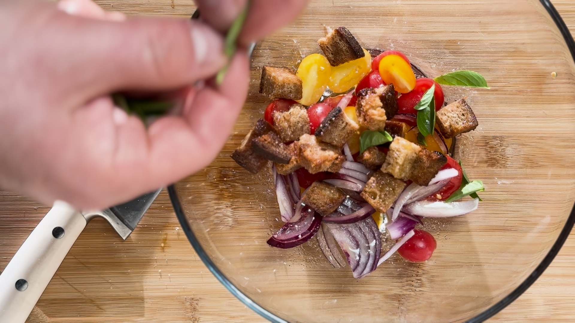 Image of Add the croutons and basil and toss in the dressing...