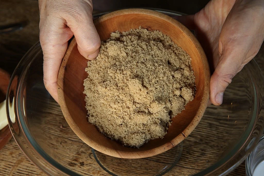 Image of Preparing the topping for the sweet potato casserole: While the...