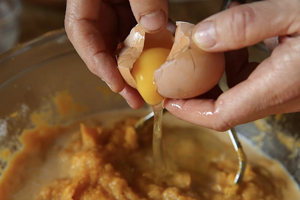 Image of Crack three eggs and add them to the bowl and...