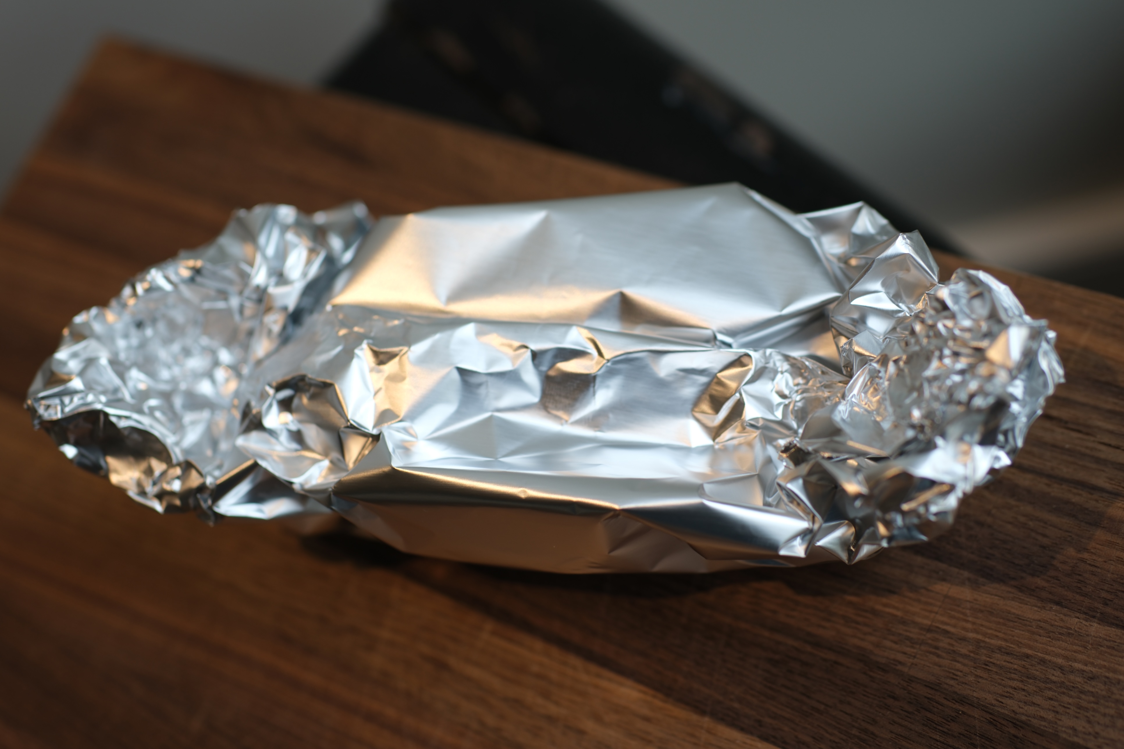 Image of wrap garlic in tin foil. drizzle with extra virgin olive...