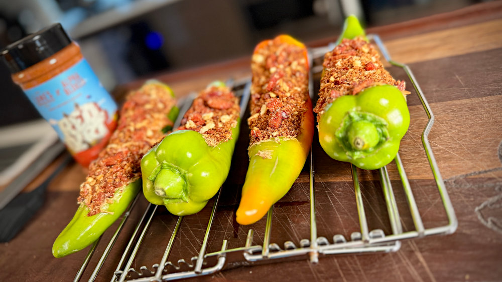 Image of Spoon the filling mixture into the chilies 