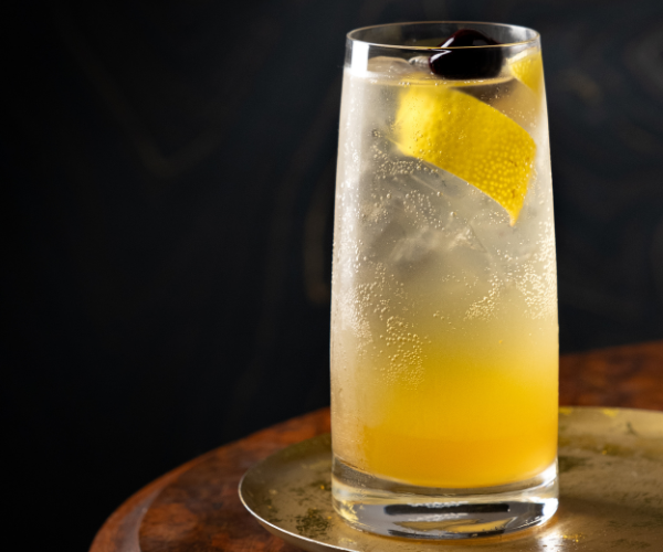 Image of In an ice-filled Highball Cocktail Glass, add bourbon, Sour Mixer,...