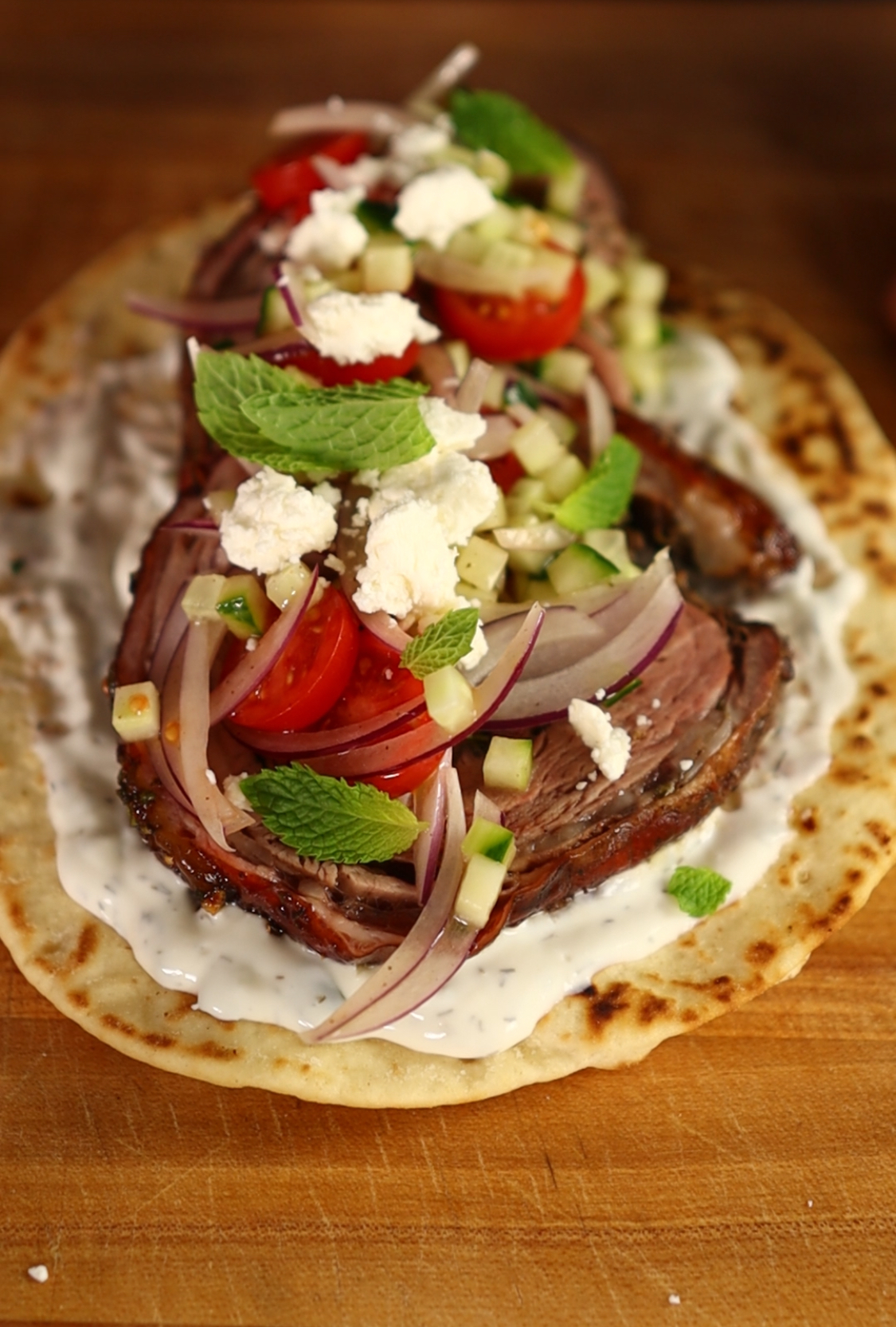 Image of Slice the meat and assemble sandwich, toasting the pita on...