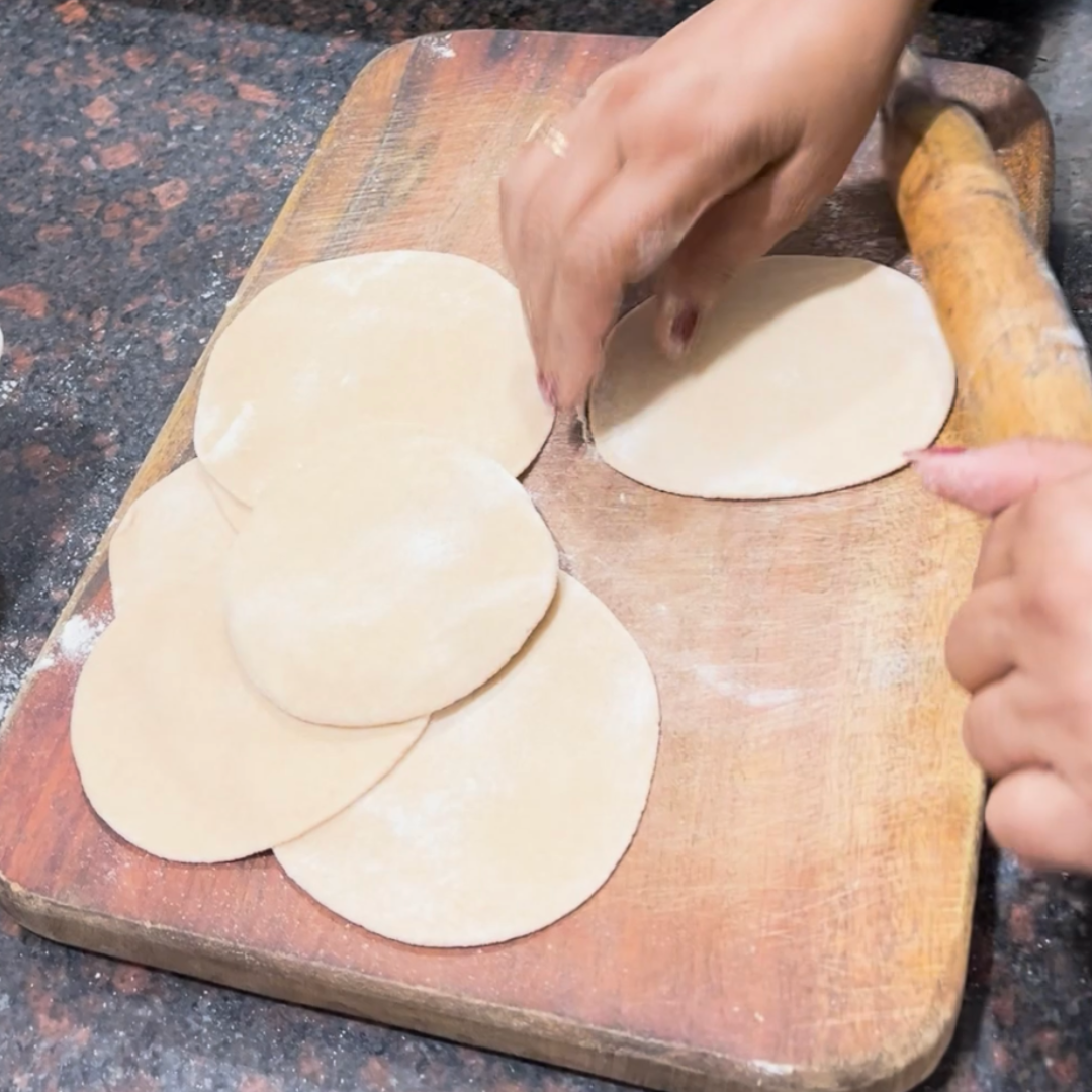 Image of Take a small portion of the prepared wheat flour dough....