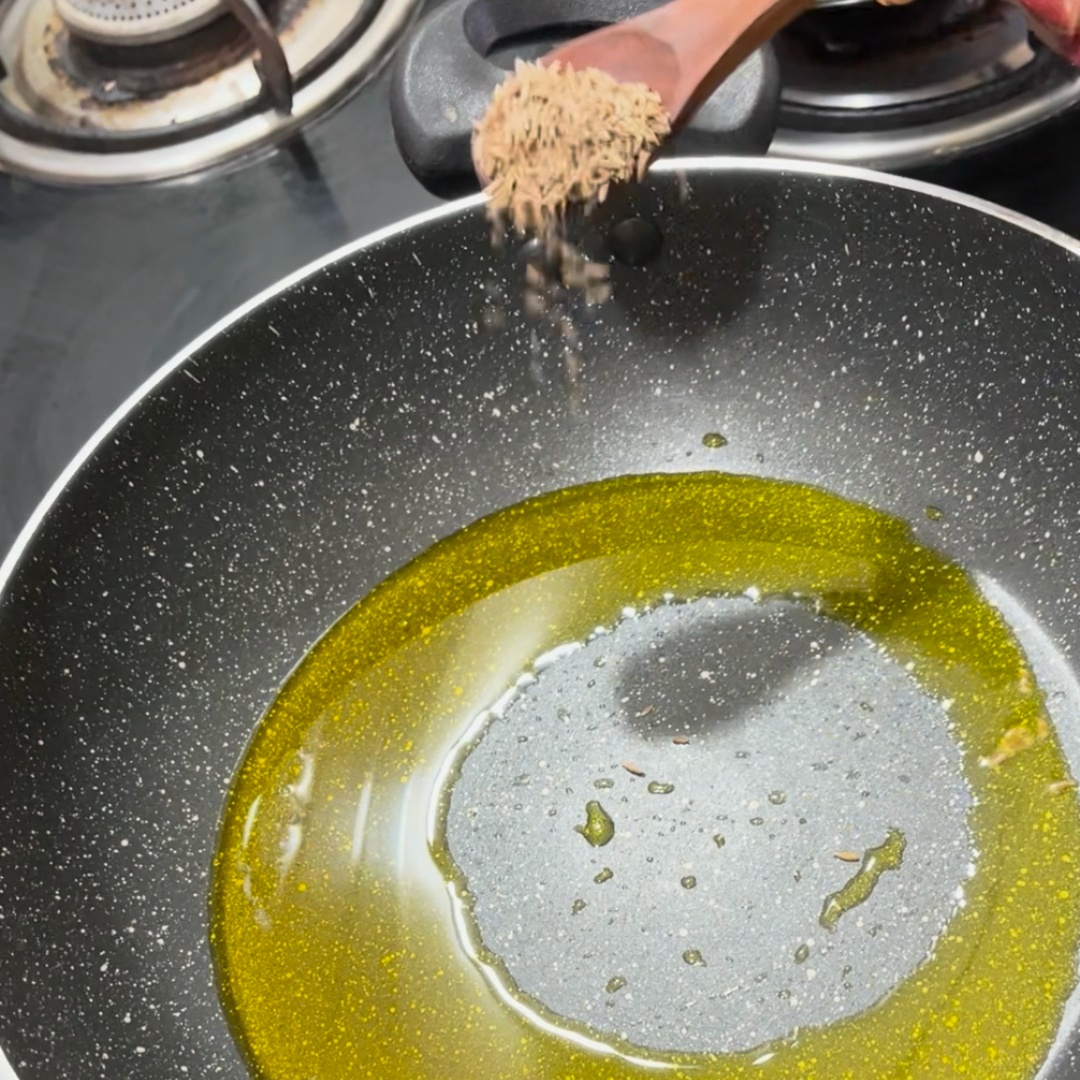 Image of Add cumin seeds and let them sizzle.