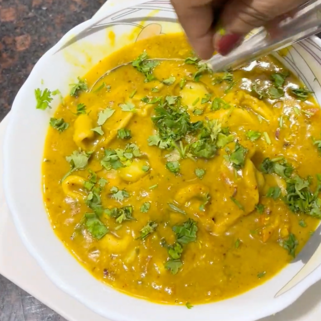 Image of Garnish with freshly chopped coriander leaves for a burst of...