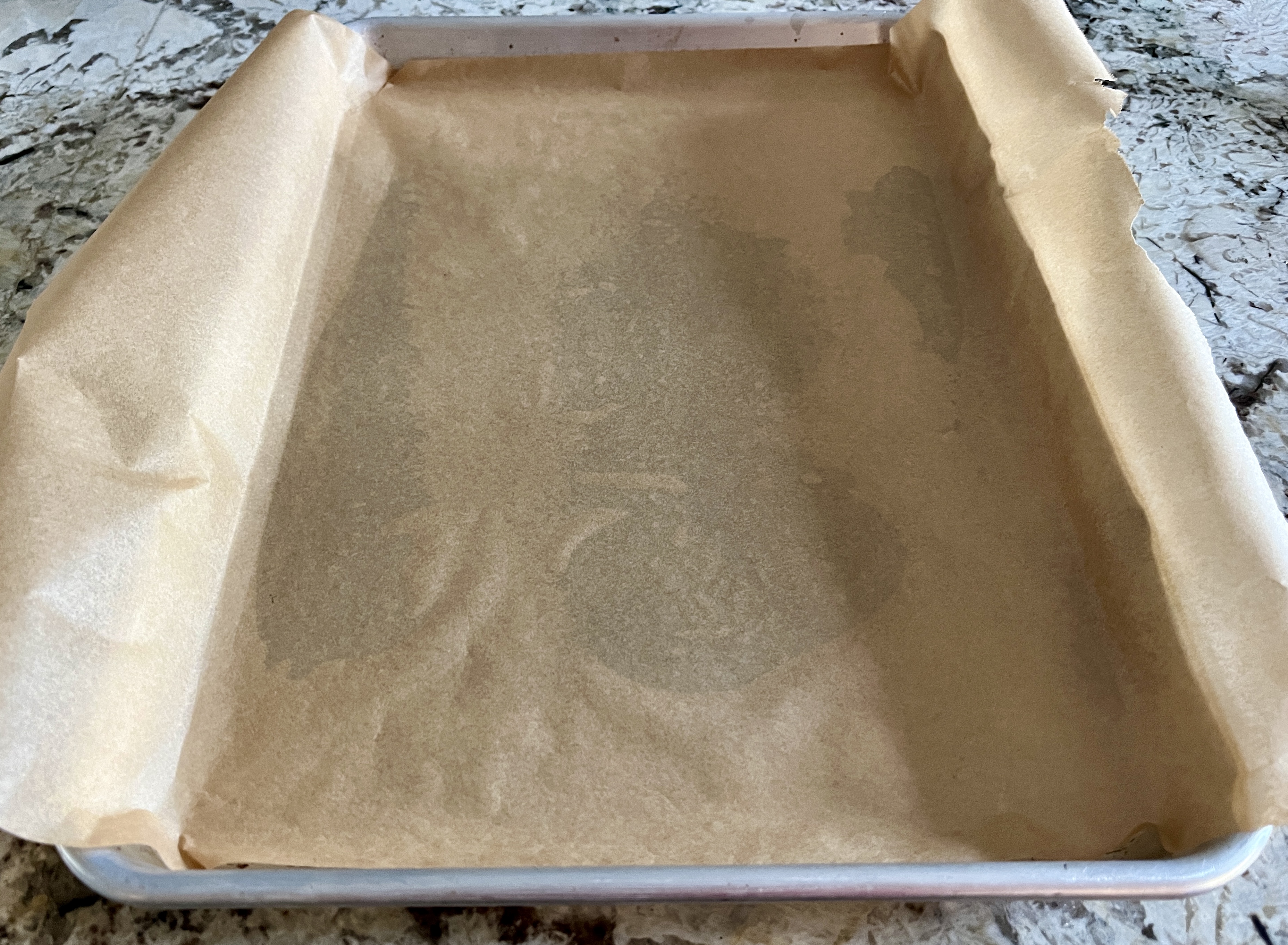 Image of Spray a small cookie sheet with cooking spray and line...