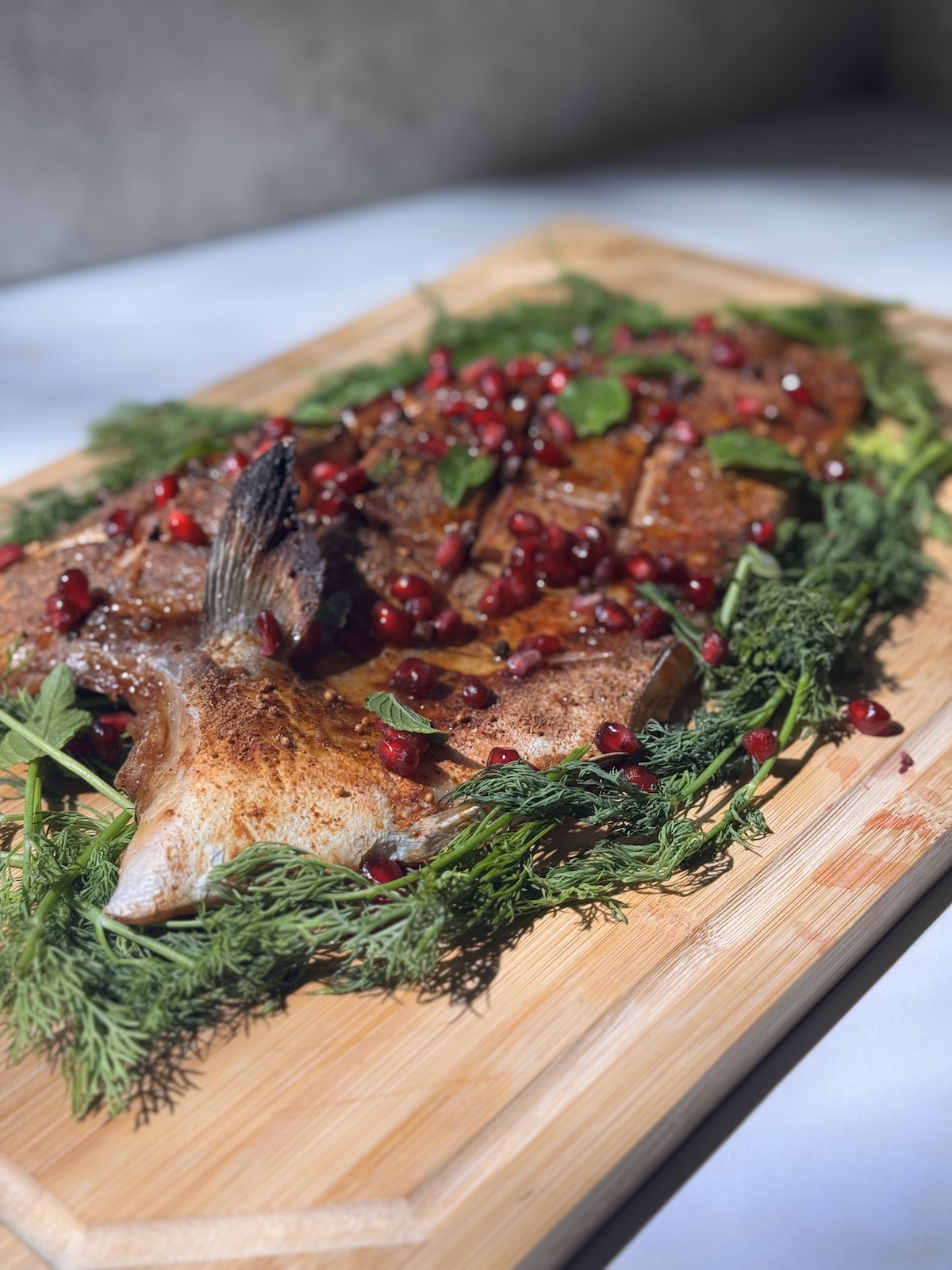 Image of Garnish Creatively: Plate the fish with fresh dill, pomegranate seeds,...