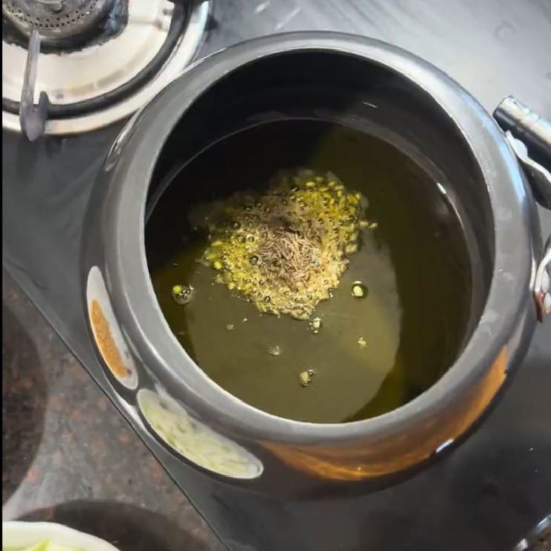 Image of Heat oil or ghee in a pressure cooker, add cumin...